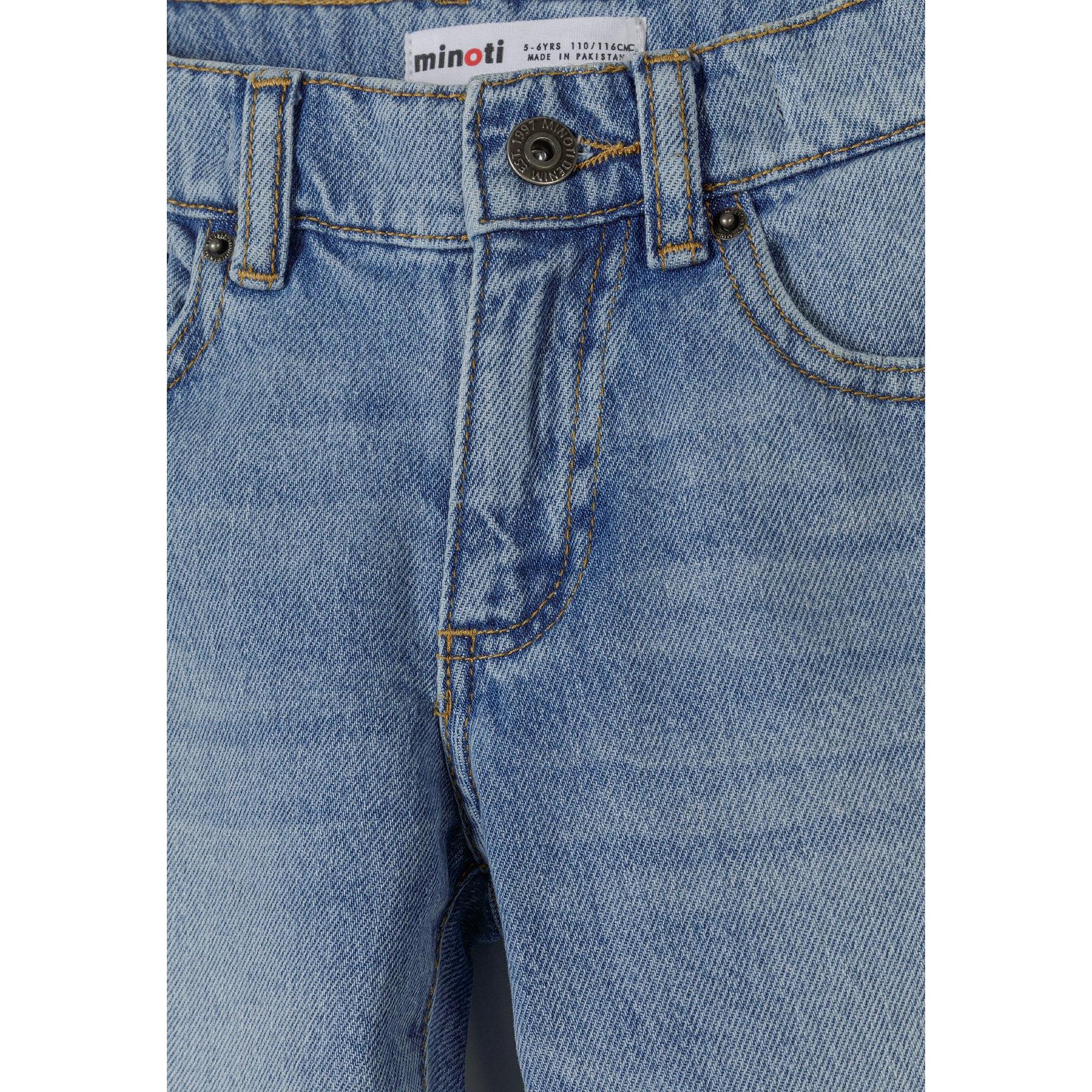Close-up detail of waistband area showing Minoti label, button fastening and belt loops on light blue denim