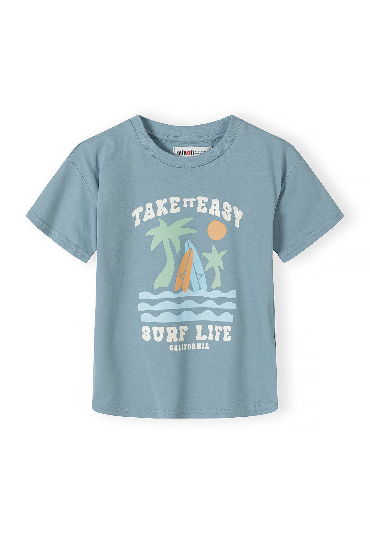 Close-up detail of white t-shirt showing palm tree and geometric pattern print with sun, waves, triangular shapes and spiral motifs in sage green color