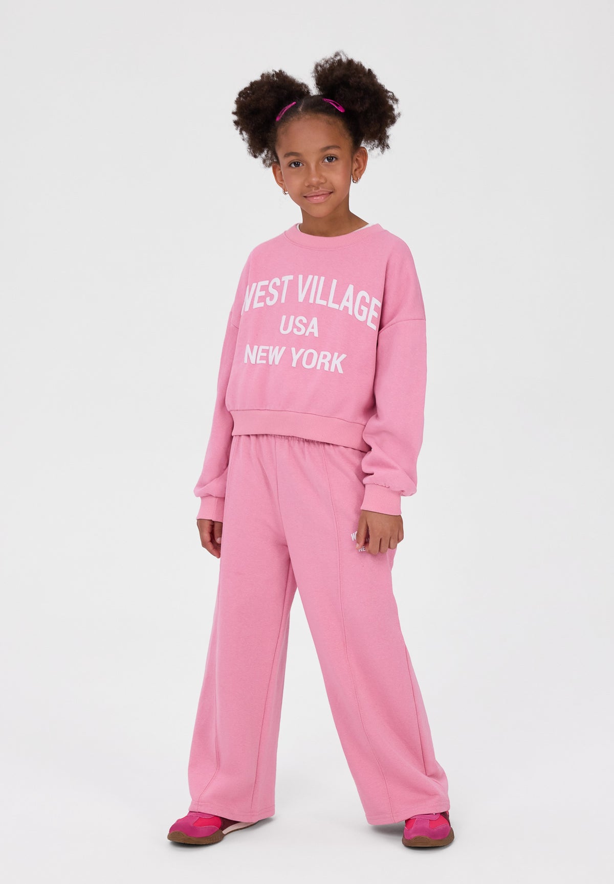 Pink sweatshirt and wide leg trousers set, full set worn front.