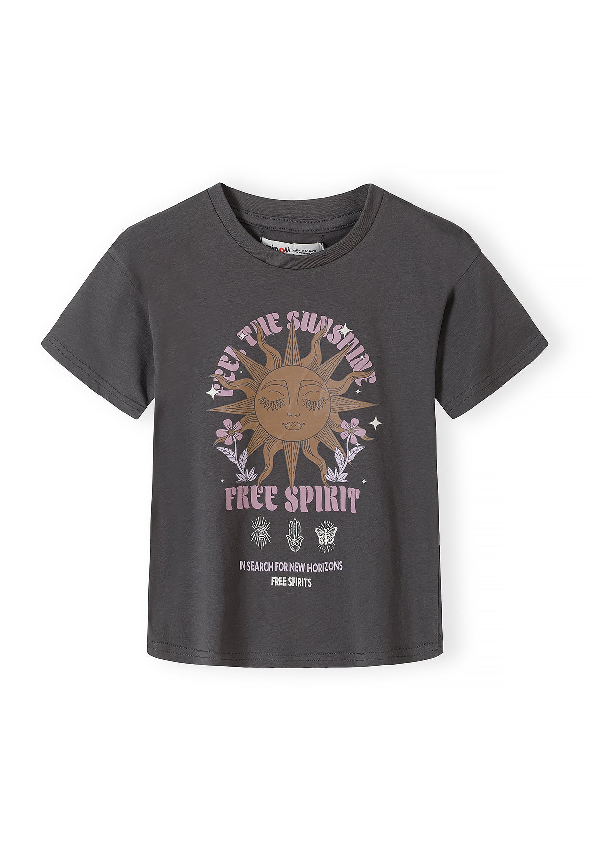 Close-up detail of charcoal t-shirt showing sunshine graphic design with sleeping sun face surrounded by radiating rays, pink text reading 'FREE SUNSHINE FREE SPIRIT' with decorative flowers and stars on grey fabric