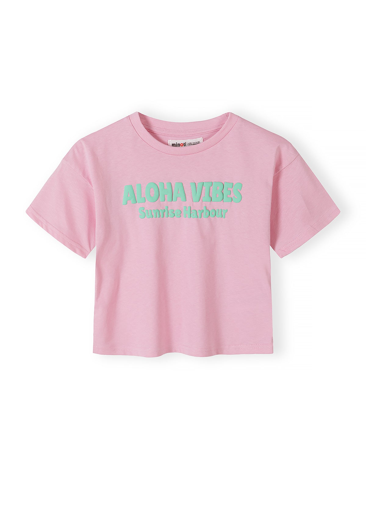 Close-up detail of hot pink t-shirt showing Minoti label at neck and Hawaiian Sun graphic print with tropical drinks, flowers and beach imagery