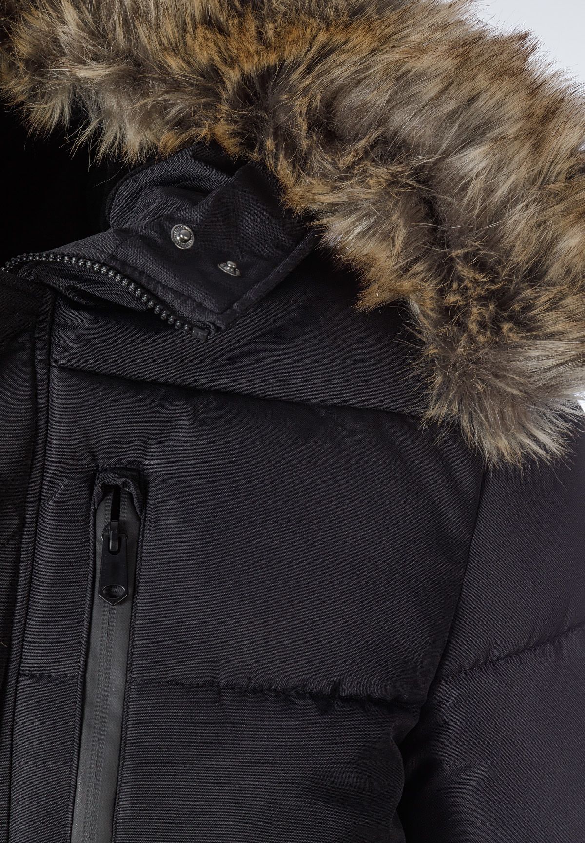 Close-up of a black padded men's jacket with faux fur trim on the hood and zip chest pocket.