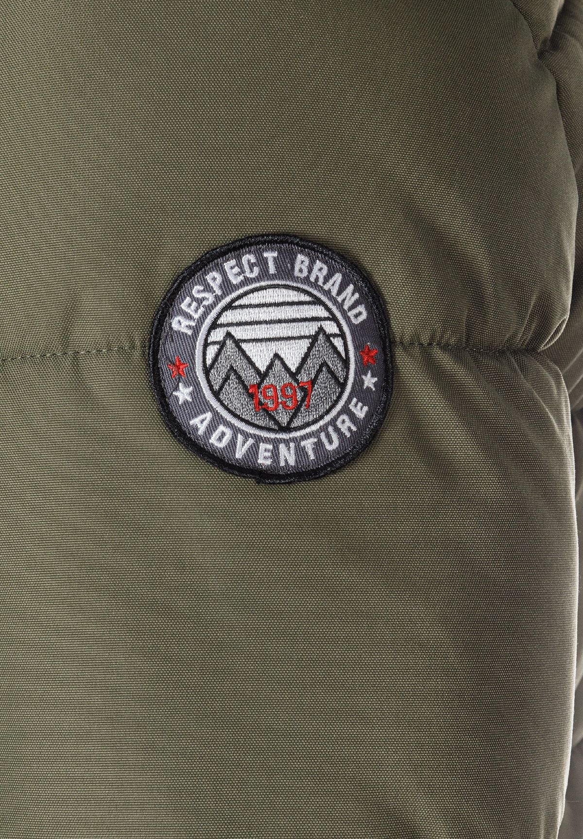 Detail of a khaki men's padded jacket featuring a logo badge.