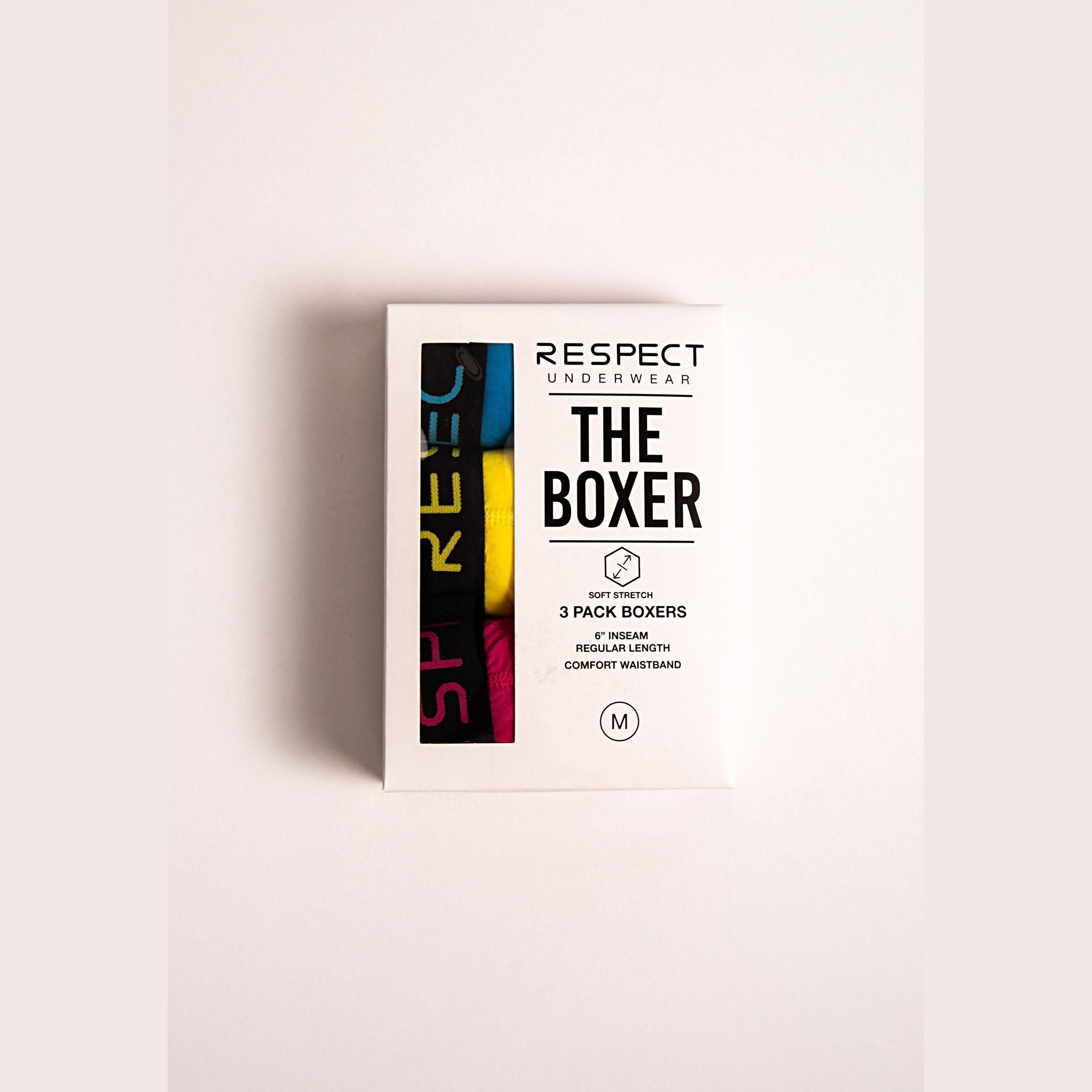 White product packaging box for RESPECT underwear showing 3-pack boxers with colourful design elements and size M label on neutral background