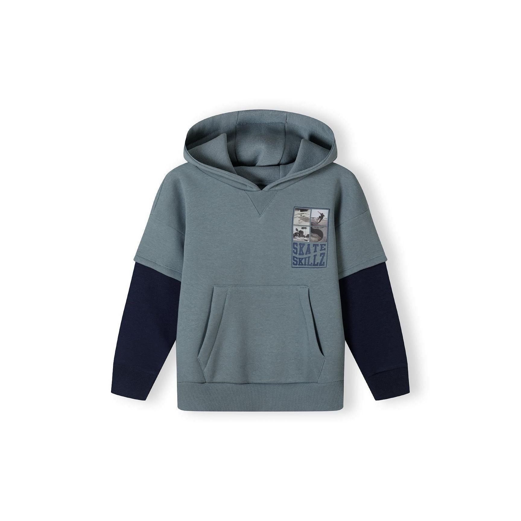 Back view of blue hoodie showing hood design and contrast navy sleeves on white background