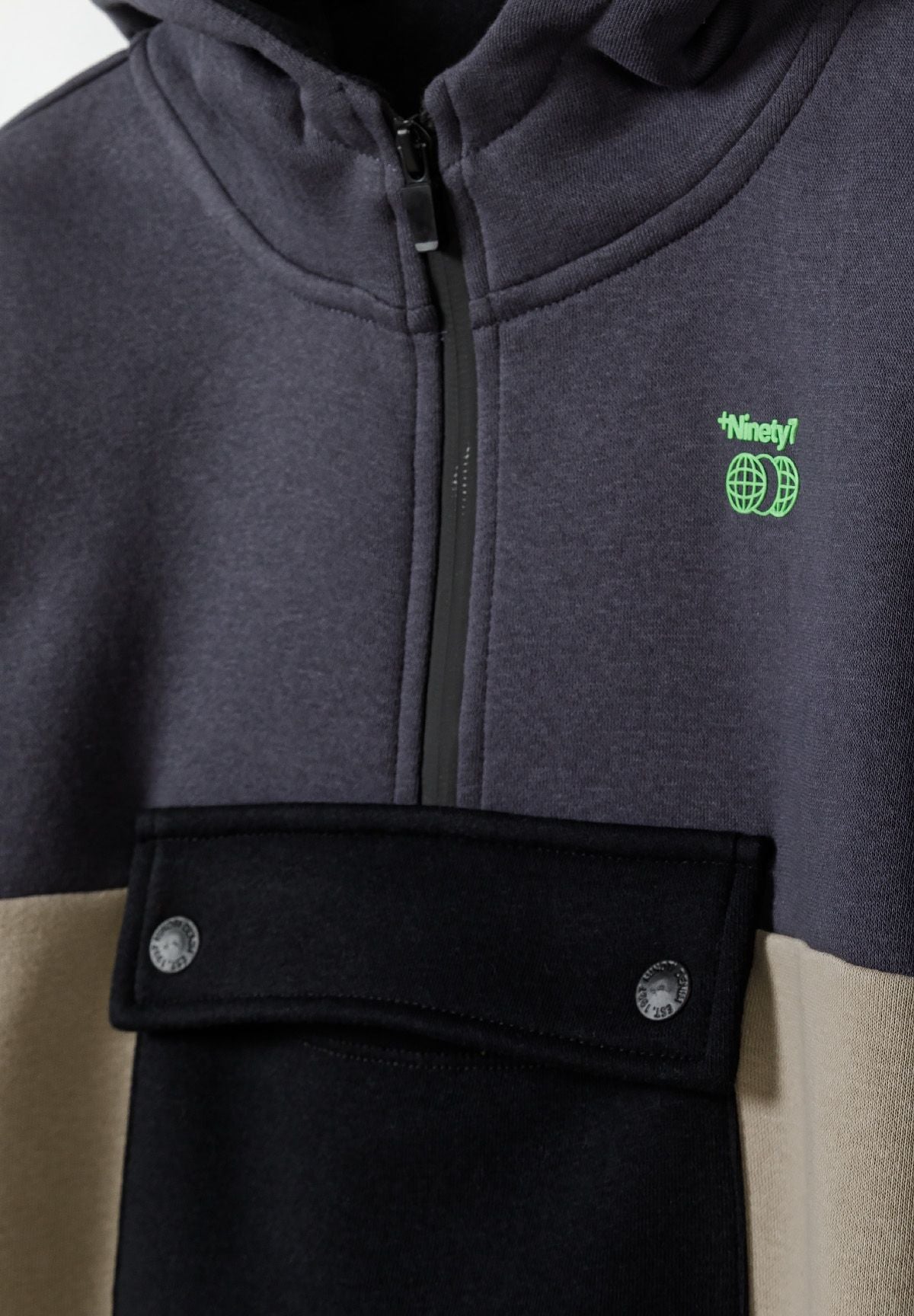 Grey, blue, beige and black colour block quarter-zip hoodie, zip and pocket detail.