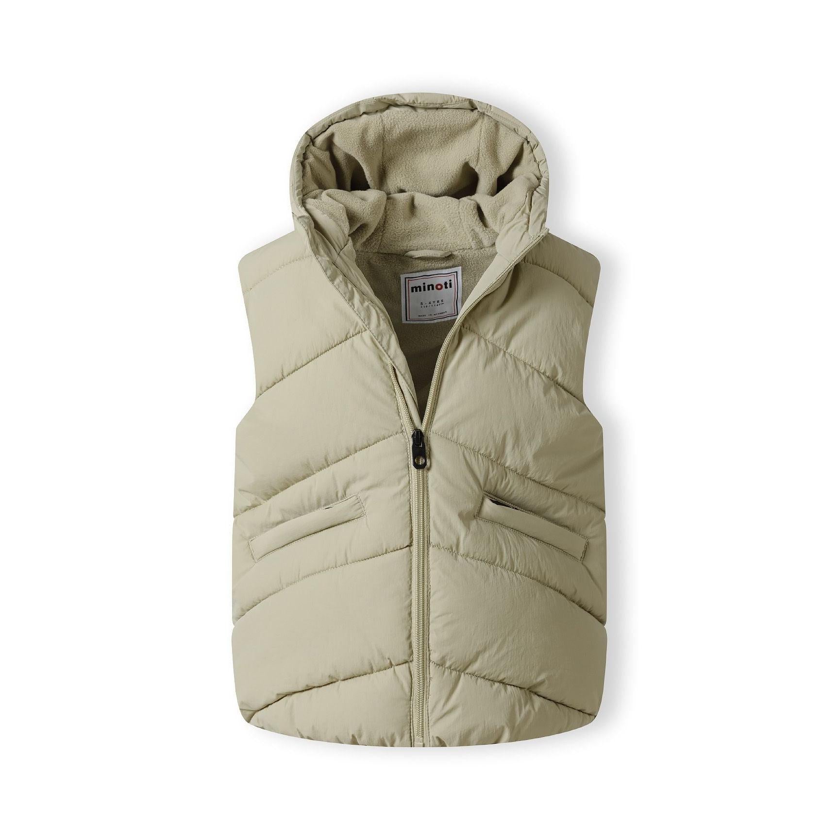 Close-up detail of sage green gilet showing zippered chest pocket and quilted fabric texture