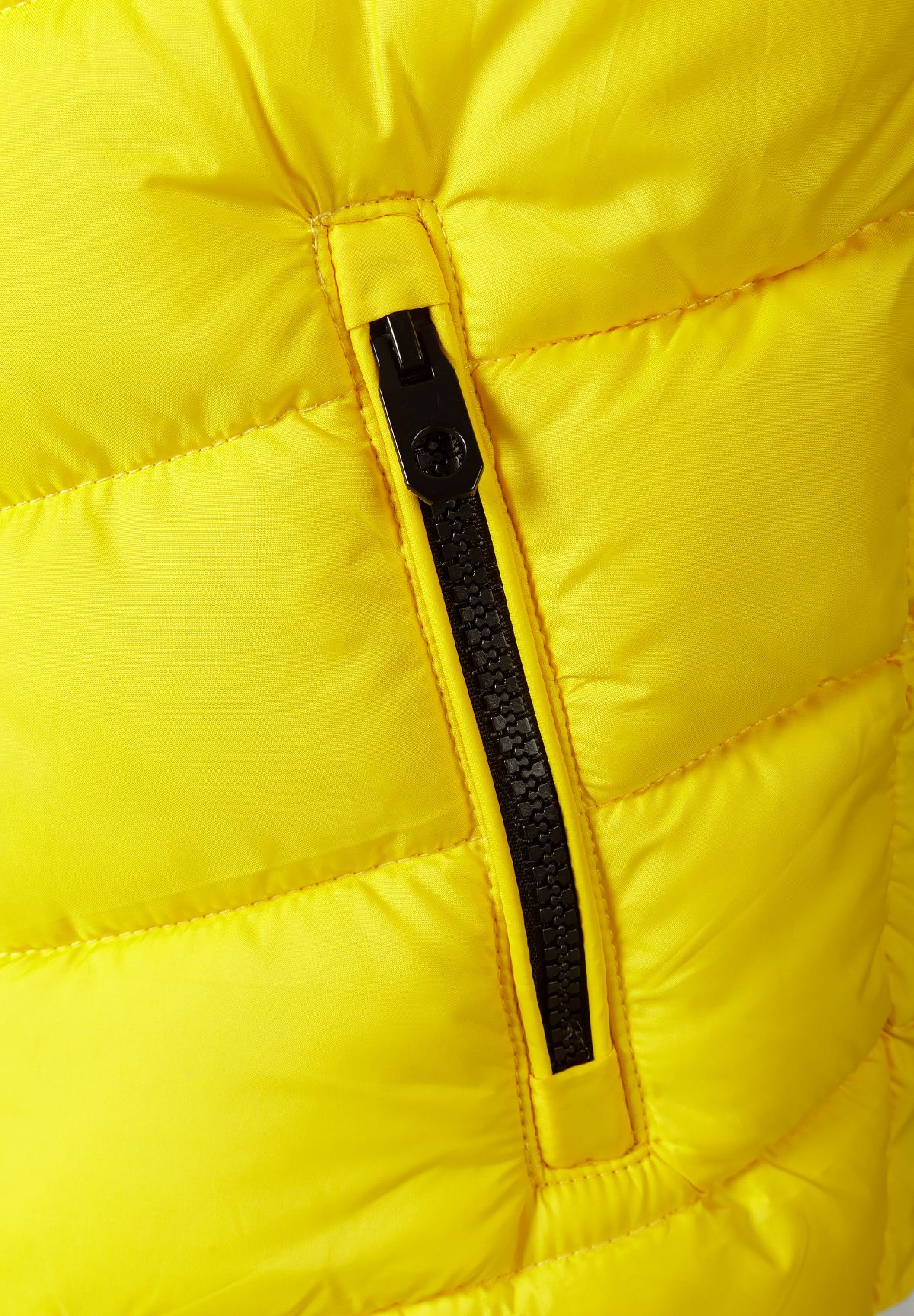 Detail of yellow boys padded gilet featuring a front zip.