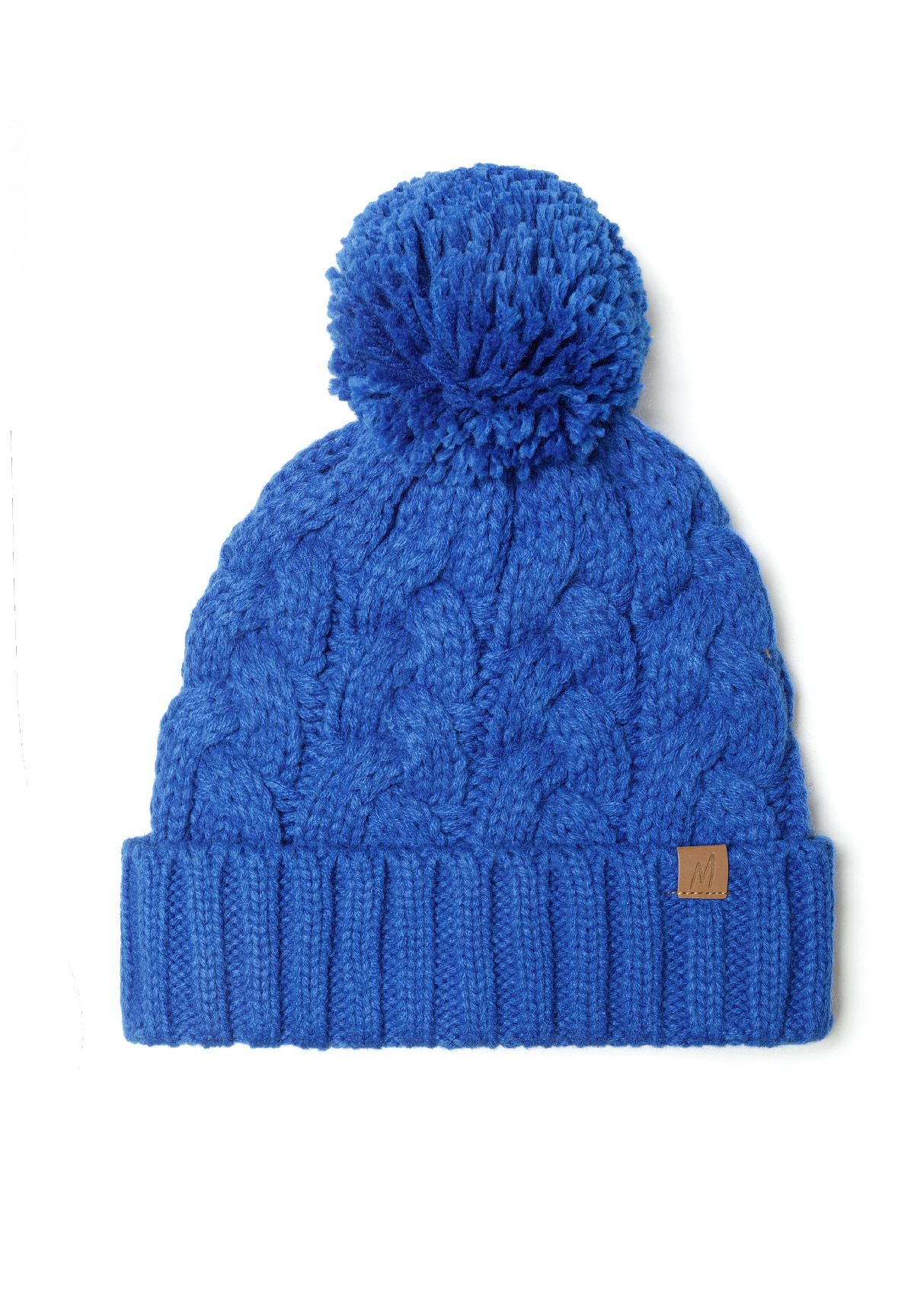 Boys knitted pom pom hat in cobalt blue, featuring a cable knit pattern and a playful pom pom on top.