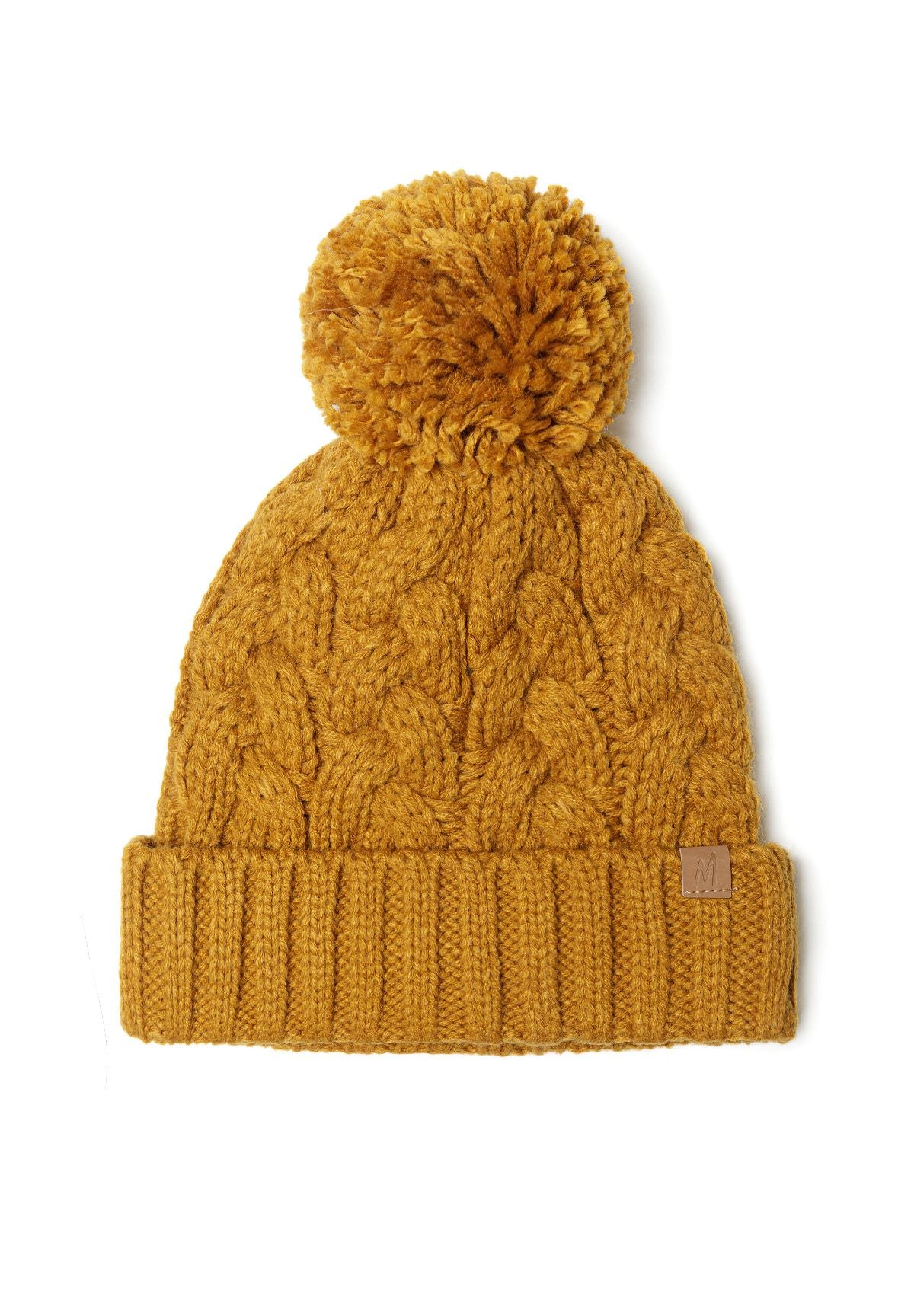 Knitted cable hat in mustard with a pom pom, front view.