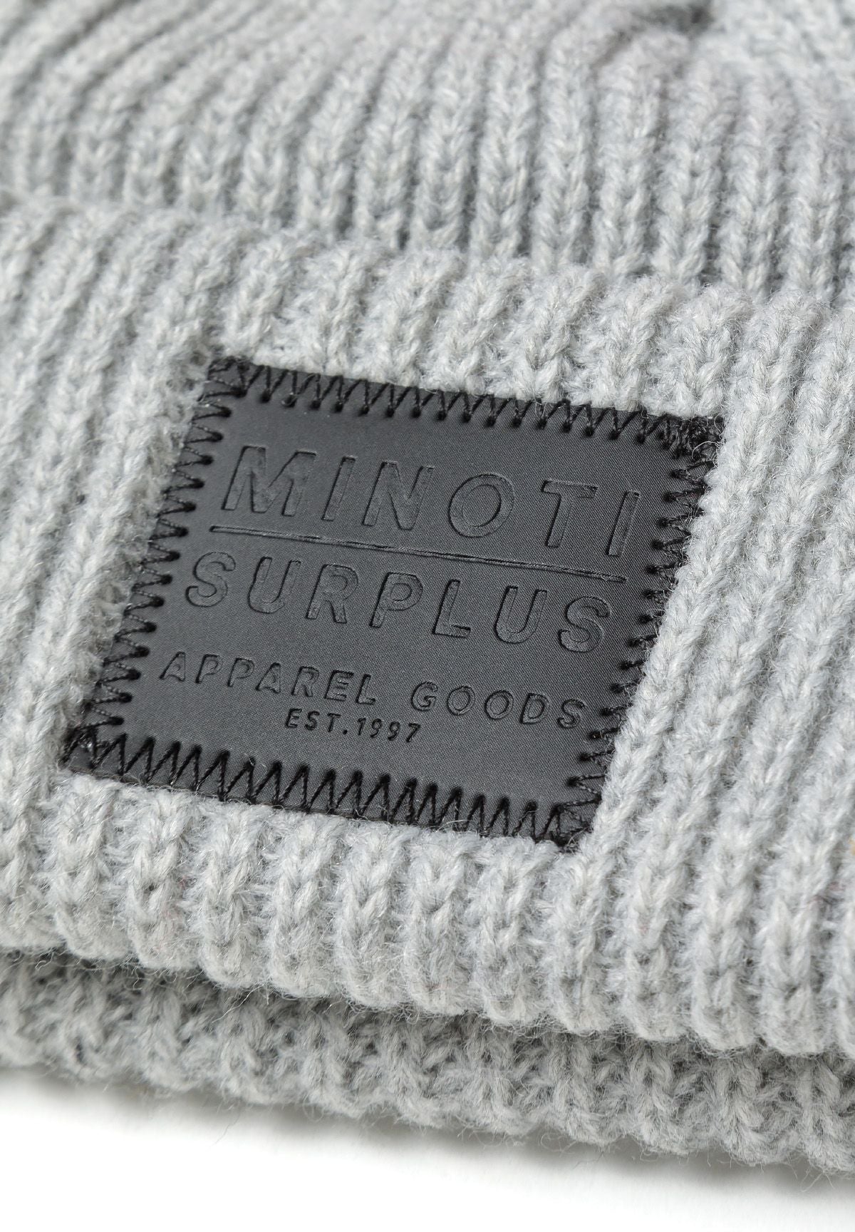 Orange and grey ribbed beanies, grey badge detail.