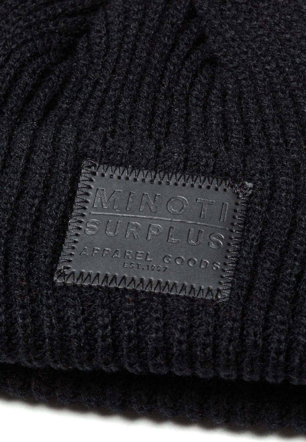 Black and burgundy ribbed beanies, black badge detail.