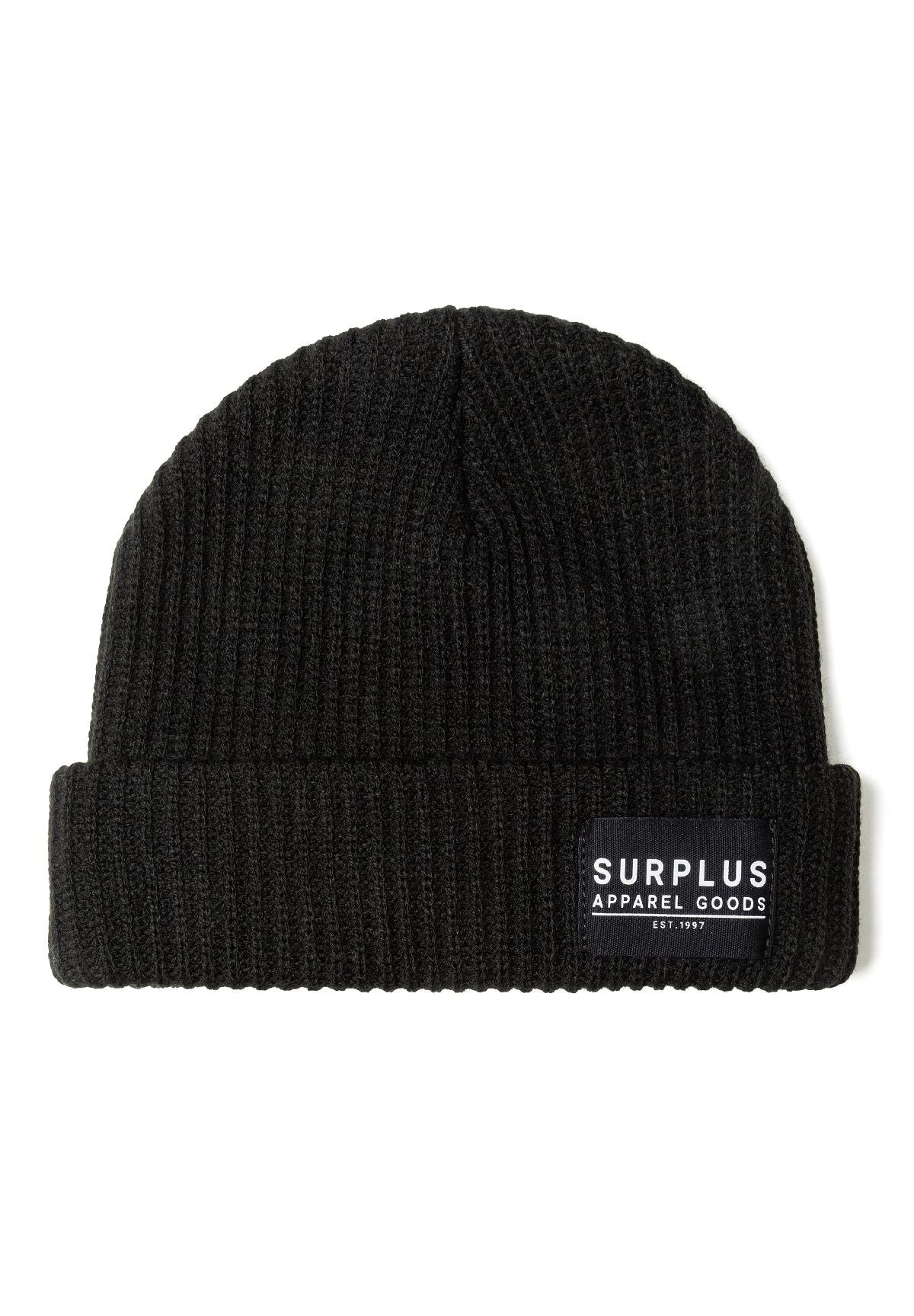 Detail of a black rib knit beanie with a logo badge on the front.