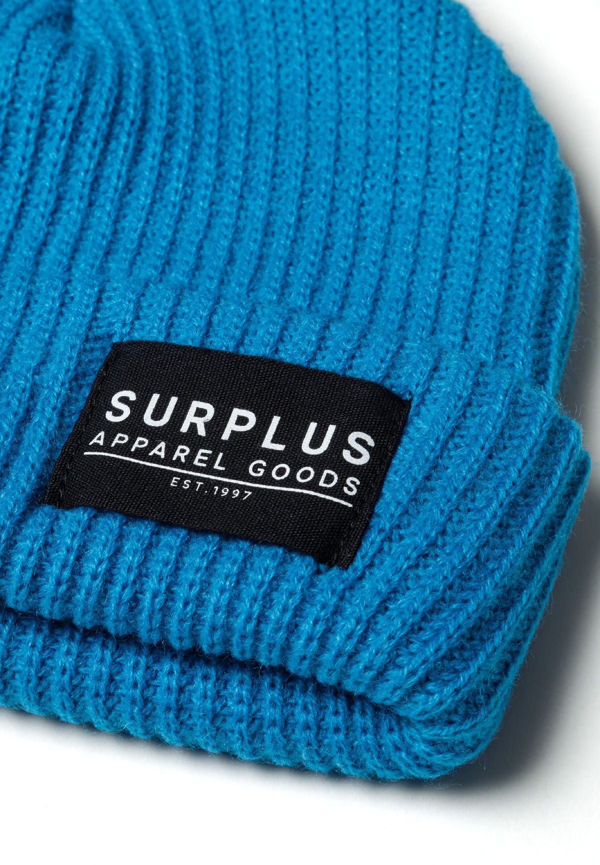 Turquoise and black ribbed beanies, turquoise badge detail.