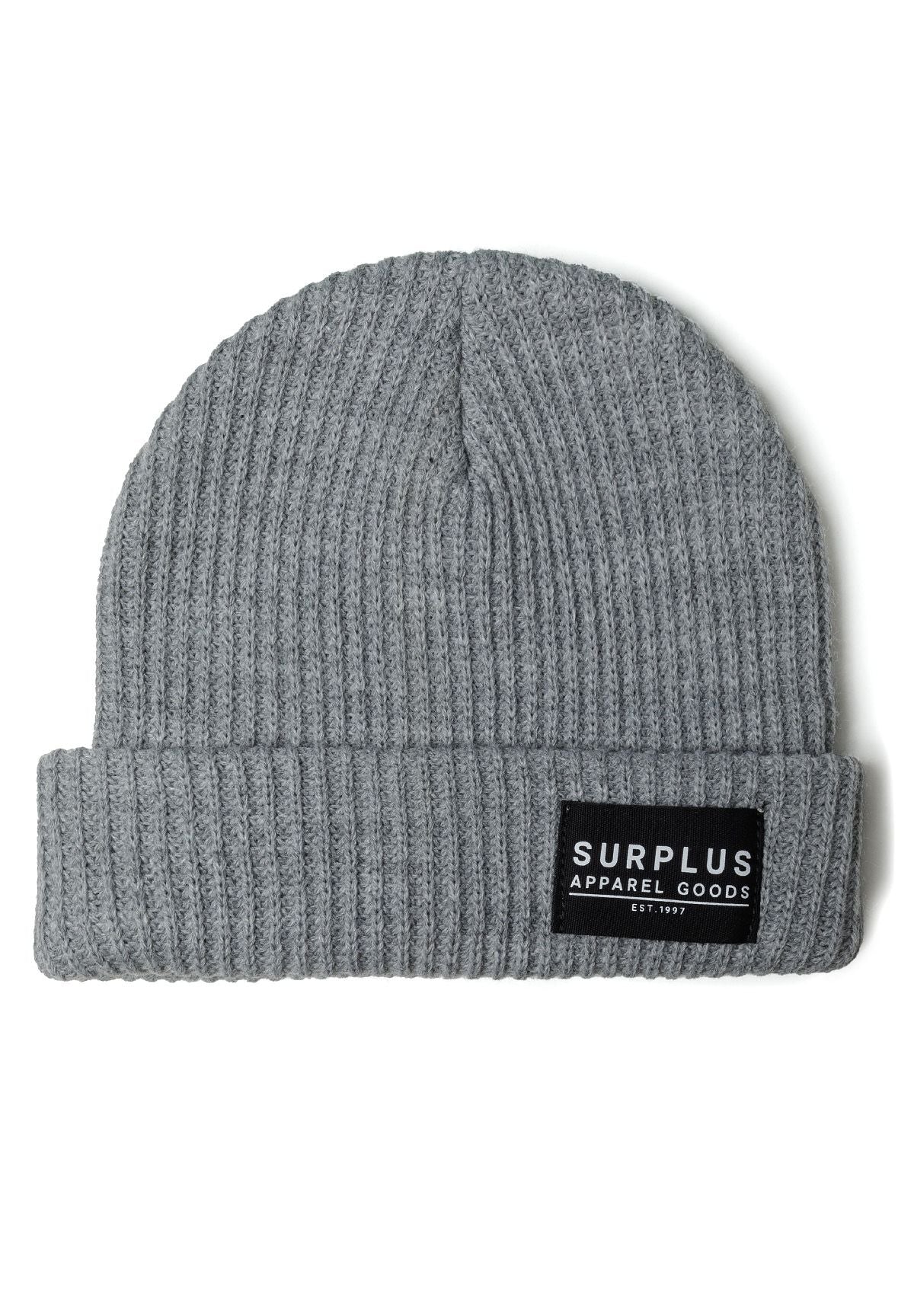 Detail of a rib knitted grey beanie with a logo badge.