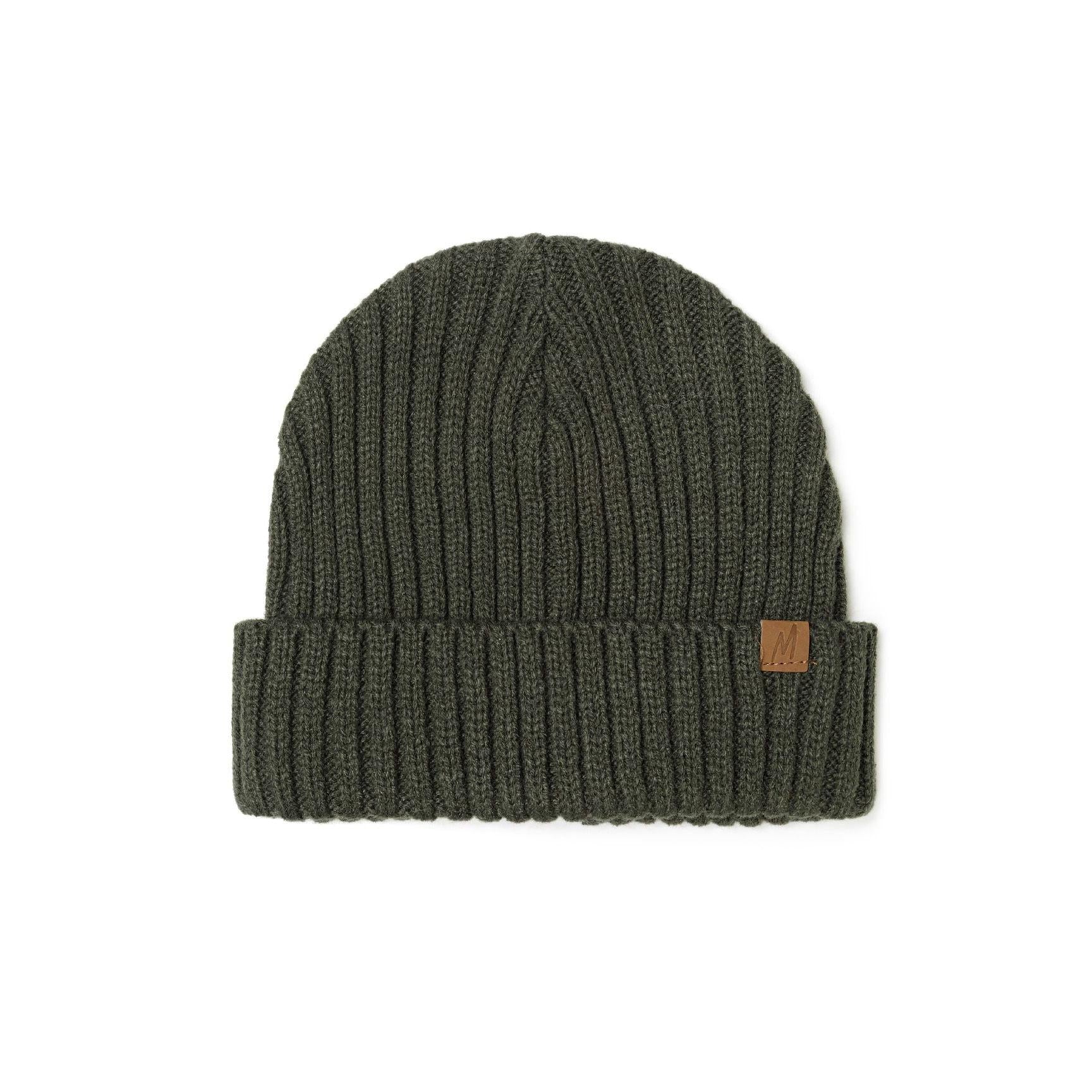 Close-up of grey ribbed knit beanie showing detailed ribbed texture, folded cuff and brown leather-look tab on white background