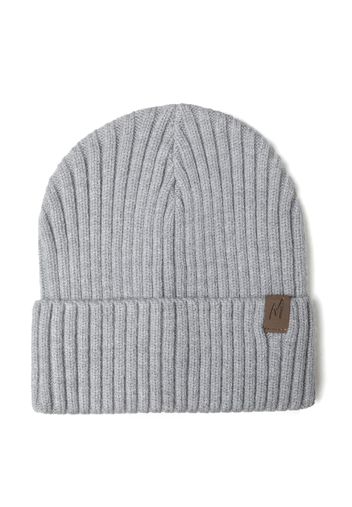 Close-up of a gray ribbed knit hat with a tab detail on the cuff.