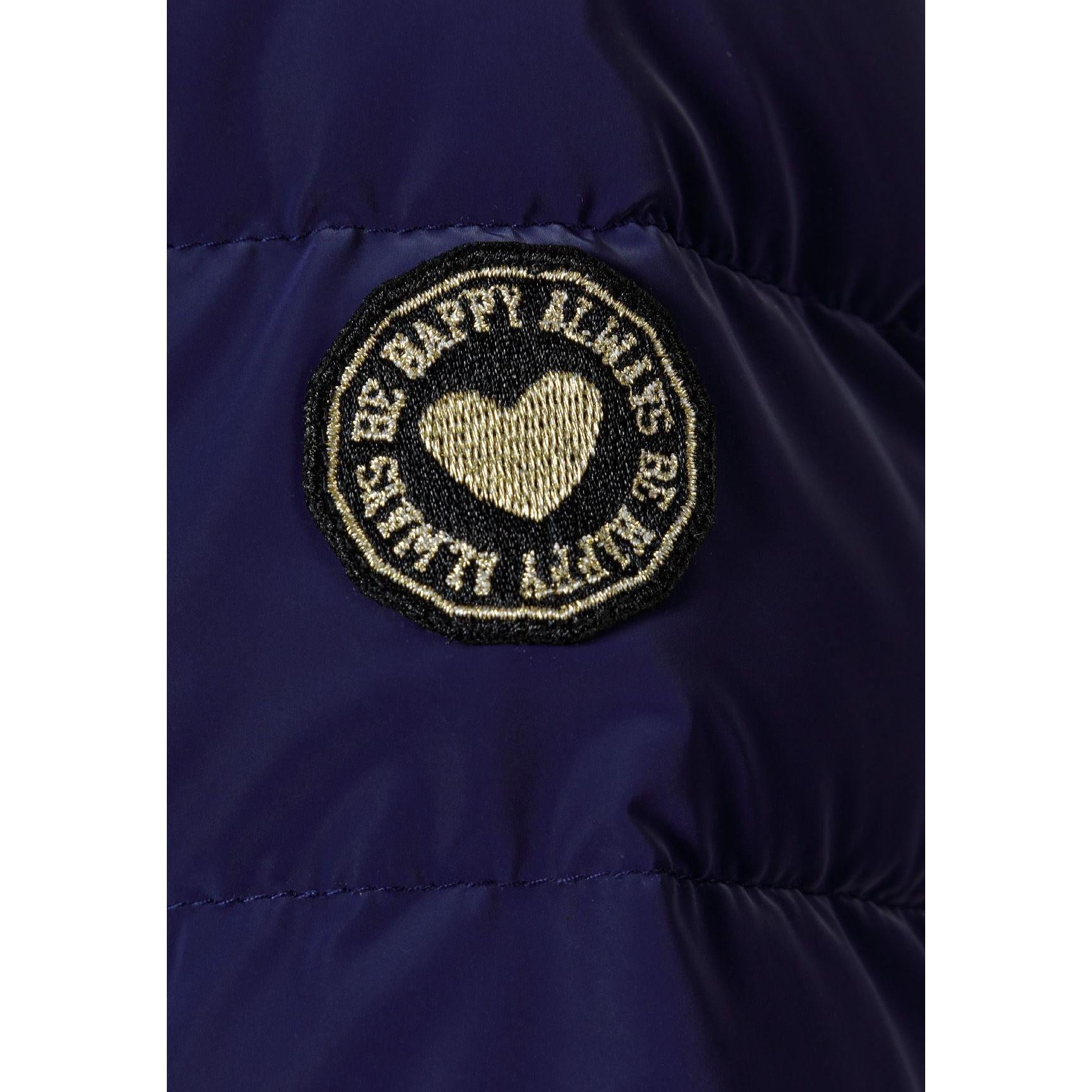 Close-up detail of navy padded jacket showing quilted texture, zip closure and soft padding construction