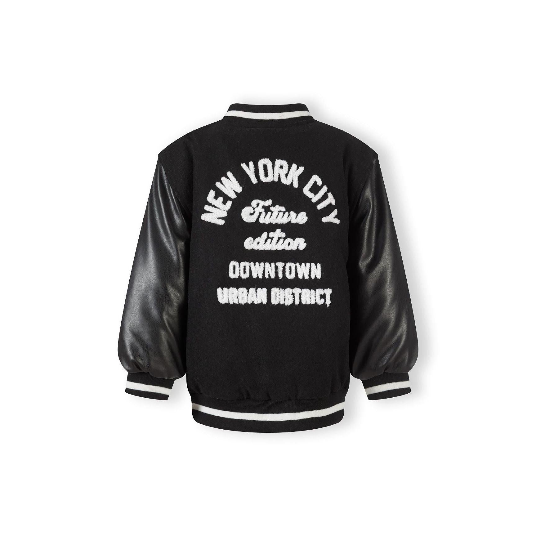 Close-up detail of black jacket showing side pocket with faux leather trim and felt body texture