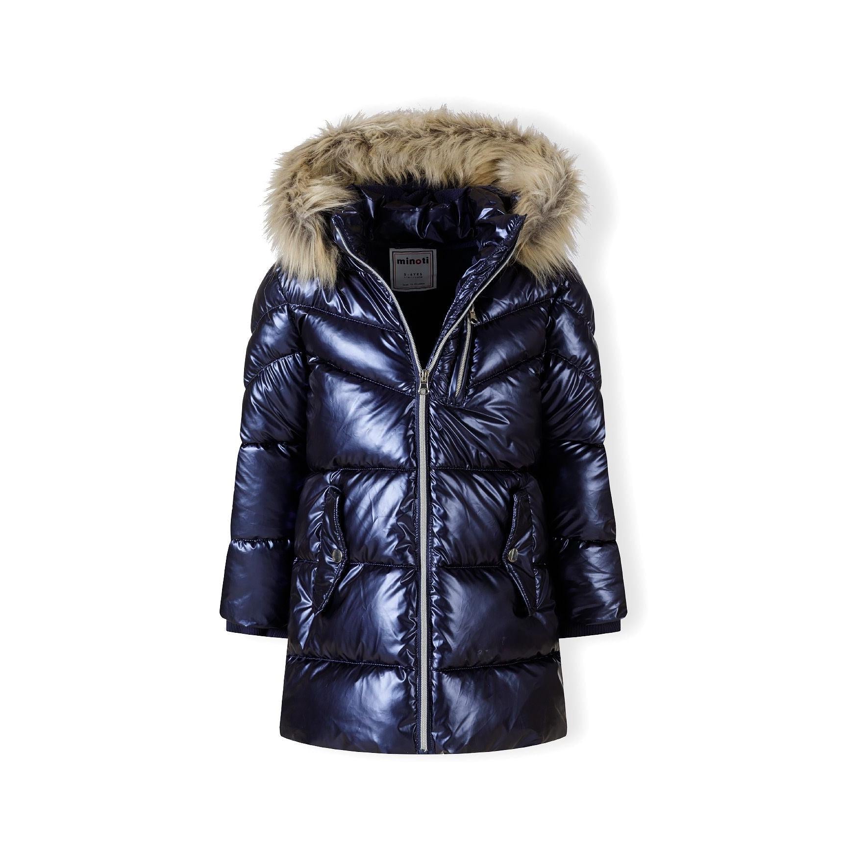 Close-up detail of navy quilted fabric showing textured surface, stitching lines and side pocket with rope drawstring