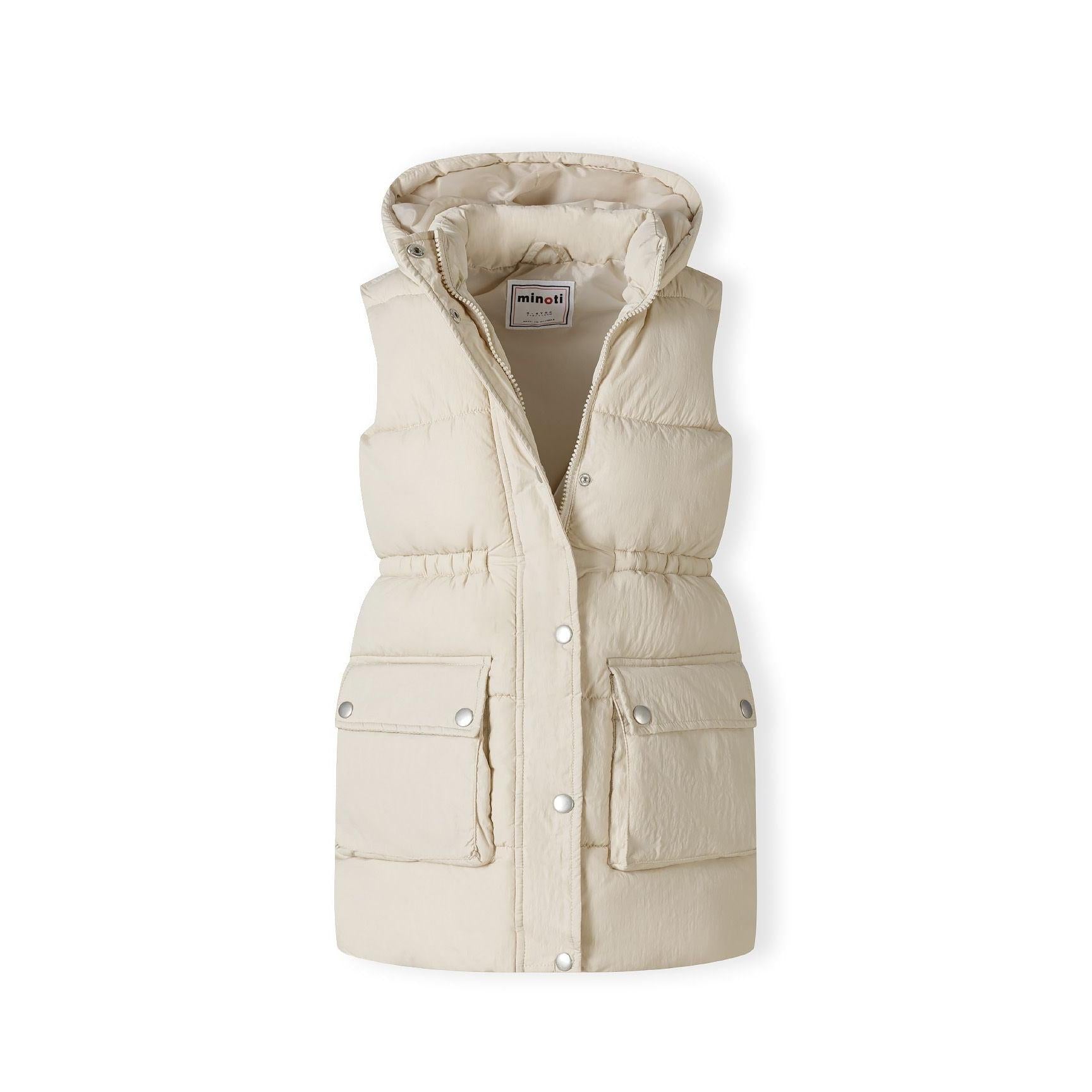 Close-up detail of cream padded gilet chest pocket with two silver snap button closures on quilted fabric