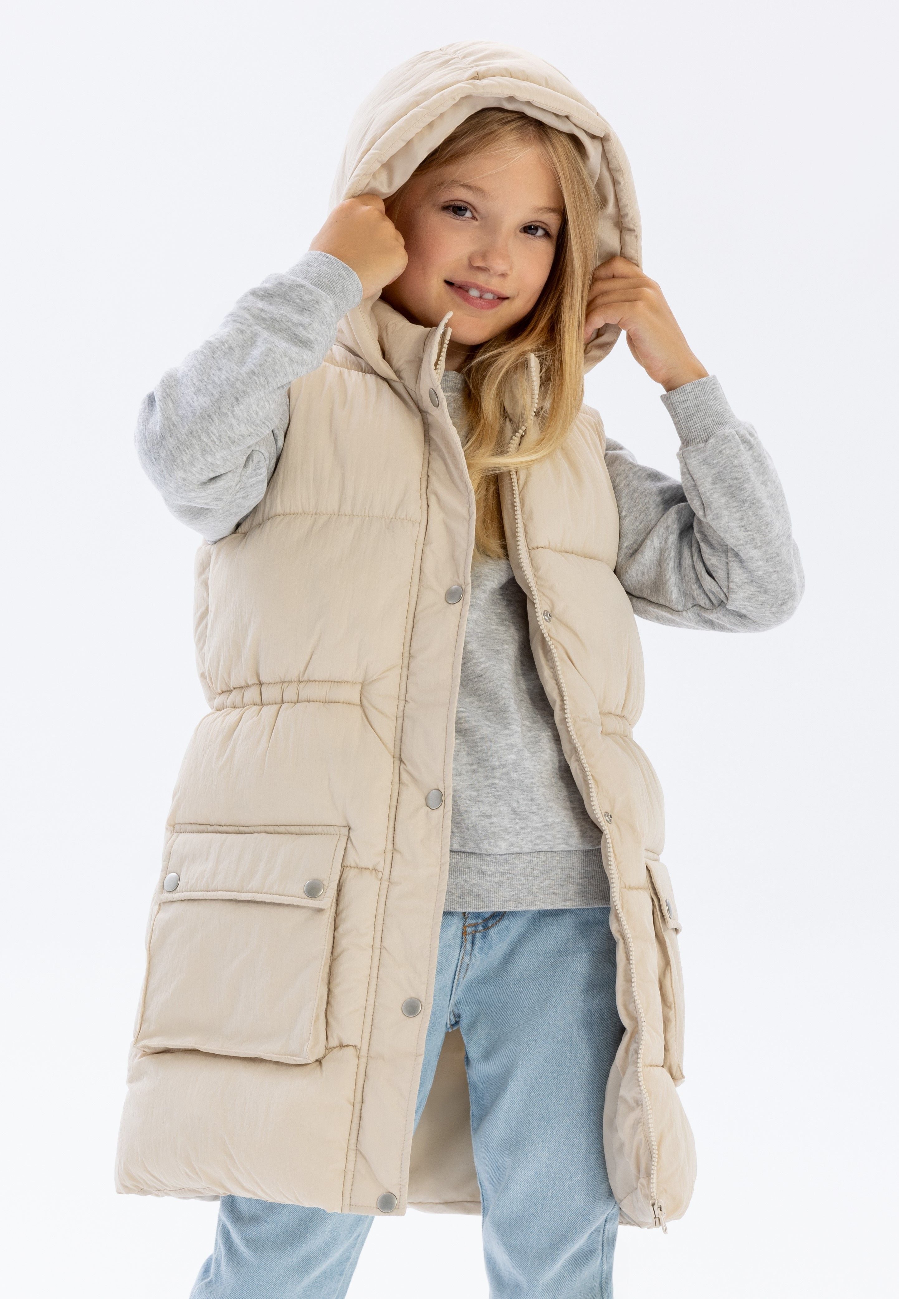 Girls padded gilet in cream, front view with snap fastening and hood.