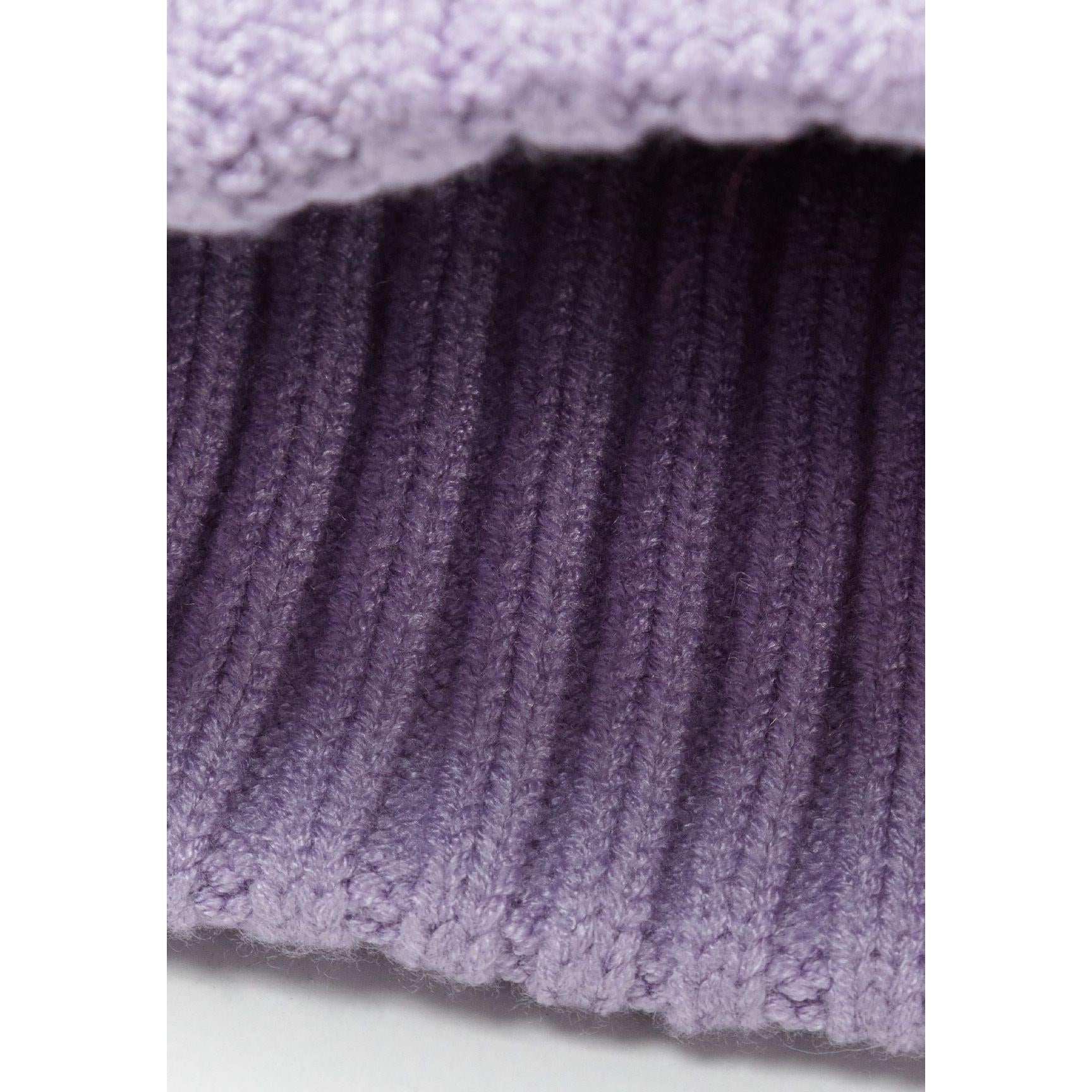Close-up texture detail of lilac ribbed knit scarf showing vertical ribbed pattern and soft knit construction