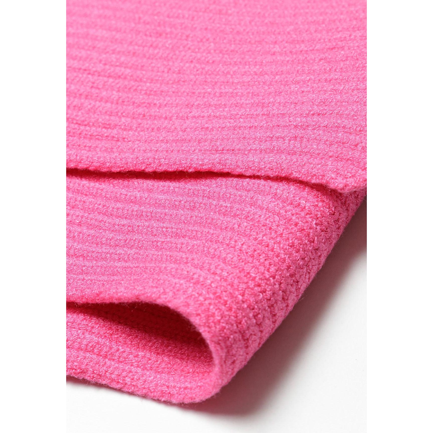 Close-up texture detail of pink ribbed knit scarf showing soft fabric weave and ribbed pattern