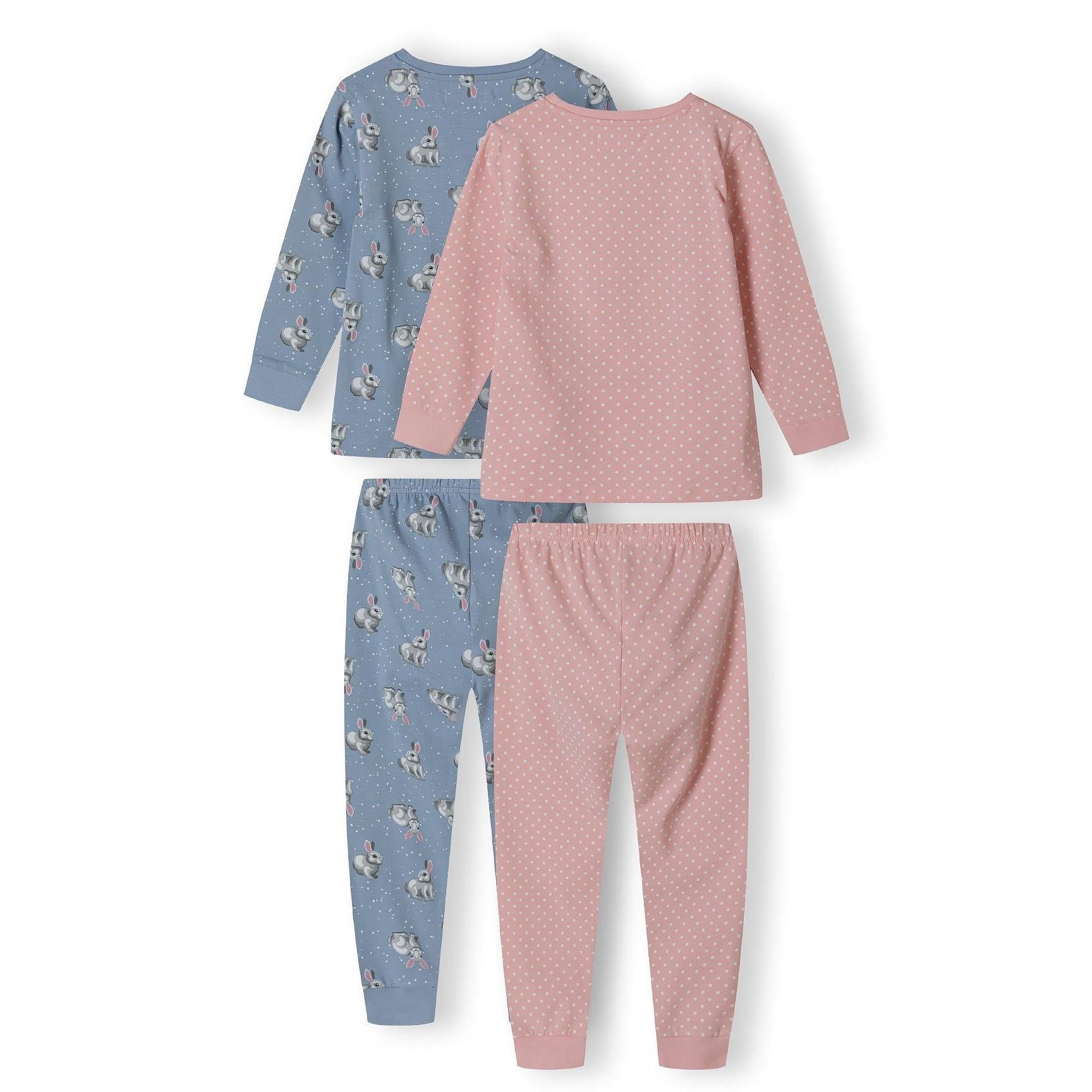 Close-up of pink polka dot pyjama bottoms showing elastic waistband and ribbed ankle cuffs with Minoti label