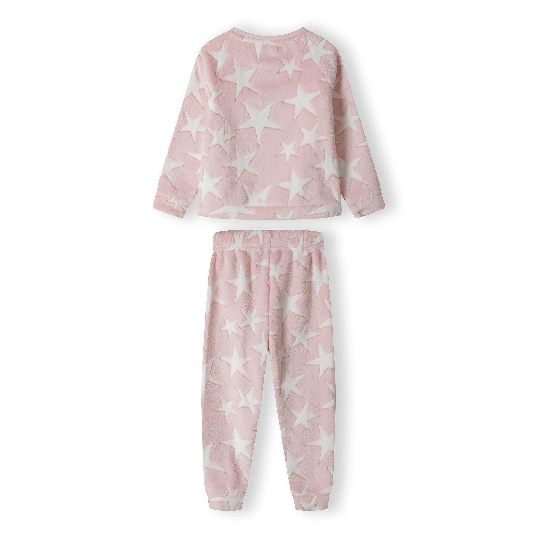 Close-up detail of pink fleece fabric showing white star print and embroidered DREAMER text in pink thread