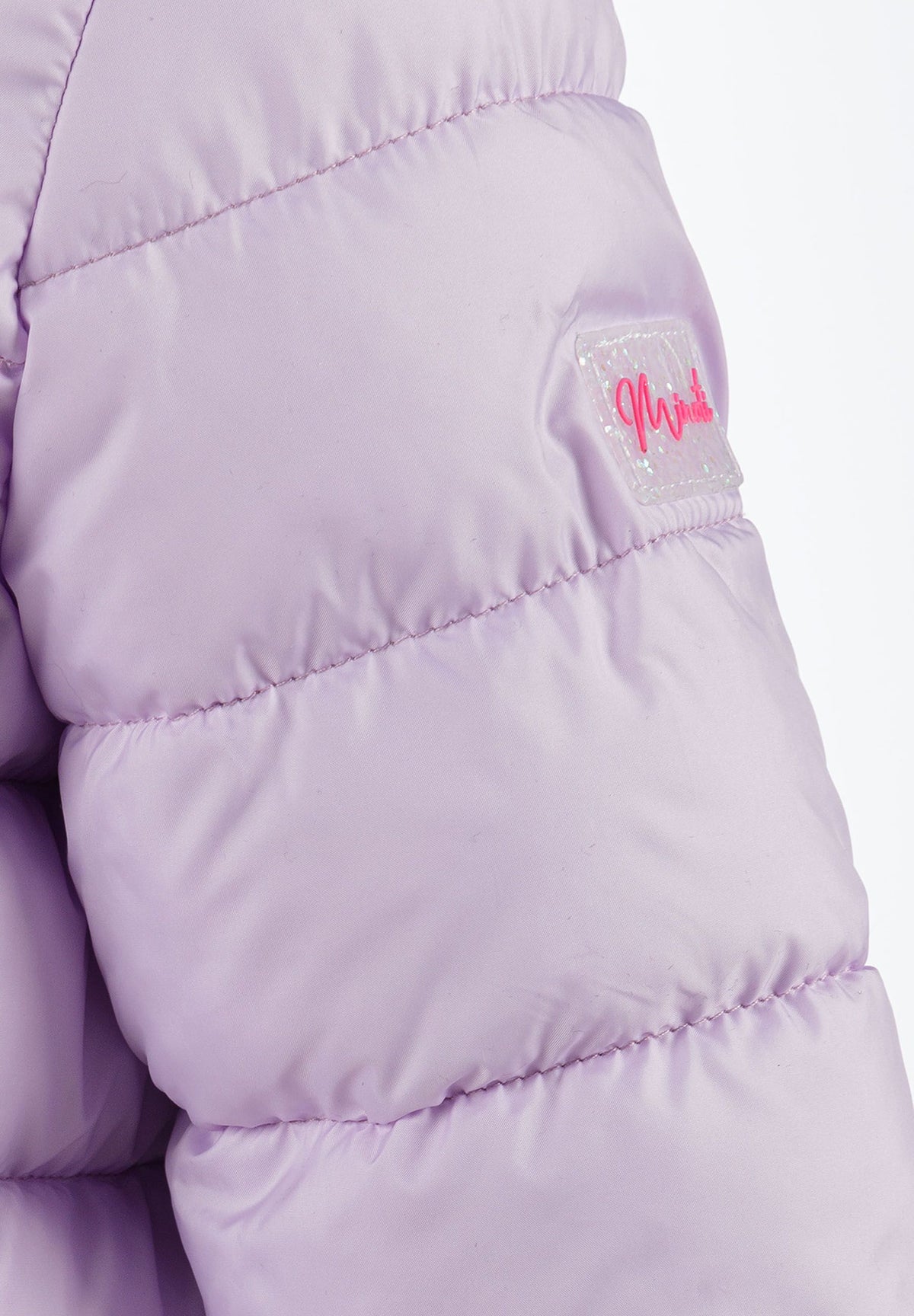 Close-up of the sleeve patch on the lilac puffer jacket.