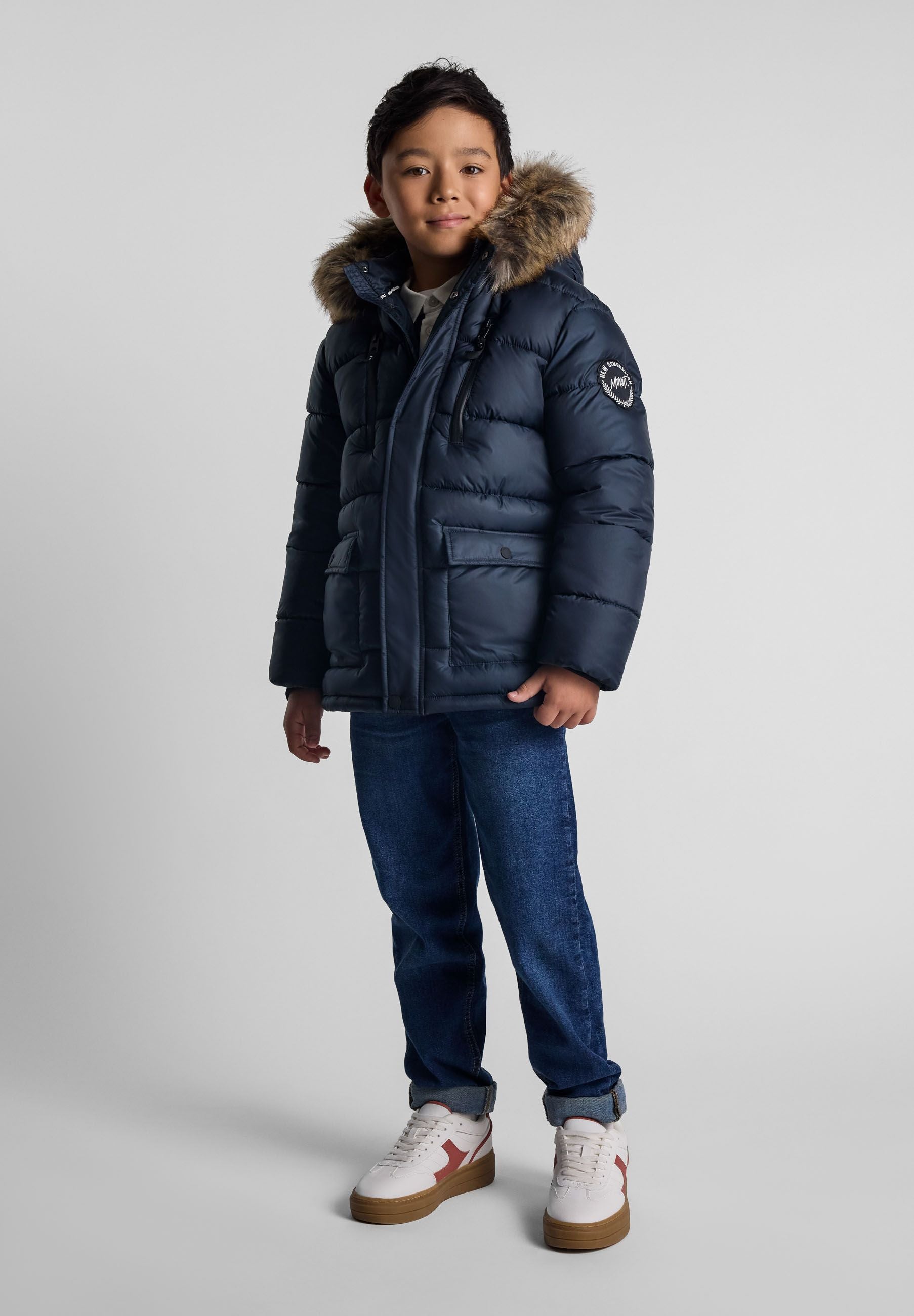Boys navy jacket with detachable fur hood, front view, featuring fleece-lined pockets.