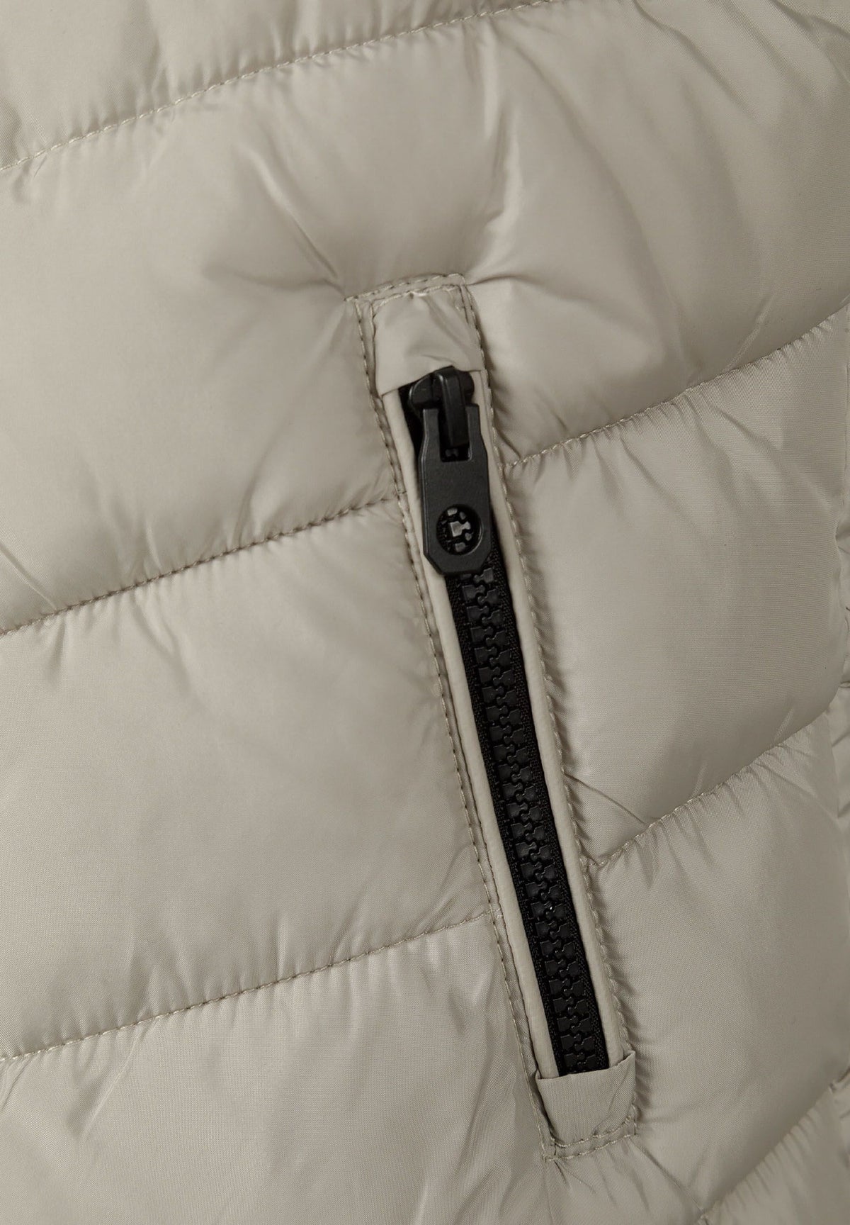 Light grey padded gilet, pocket zip detail.