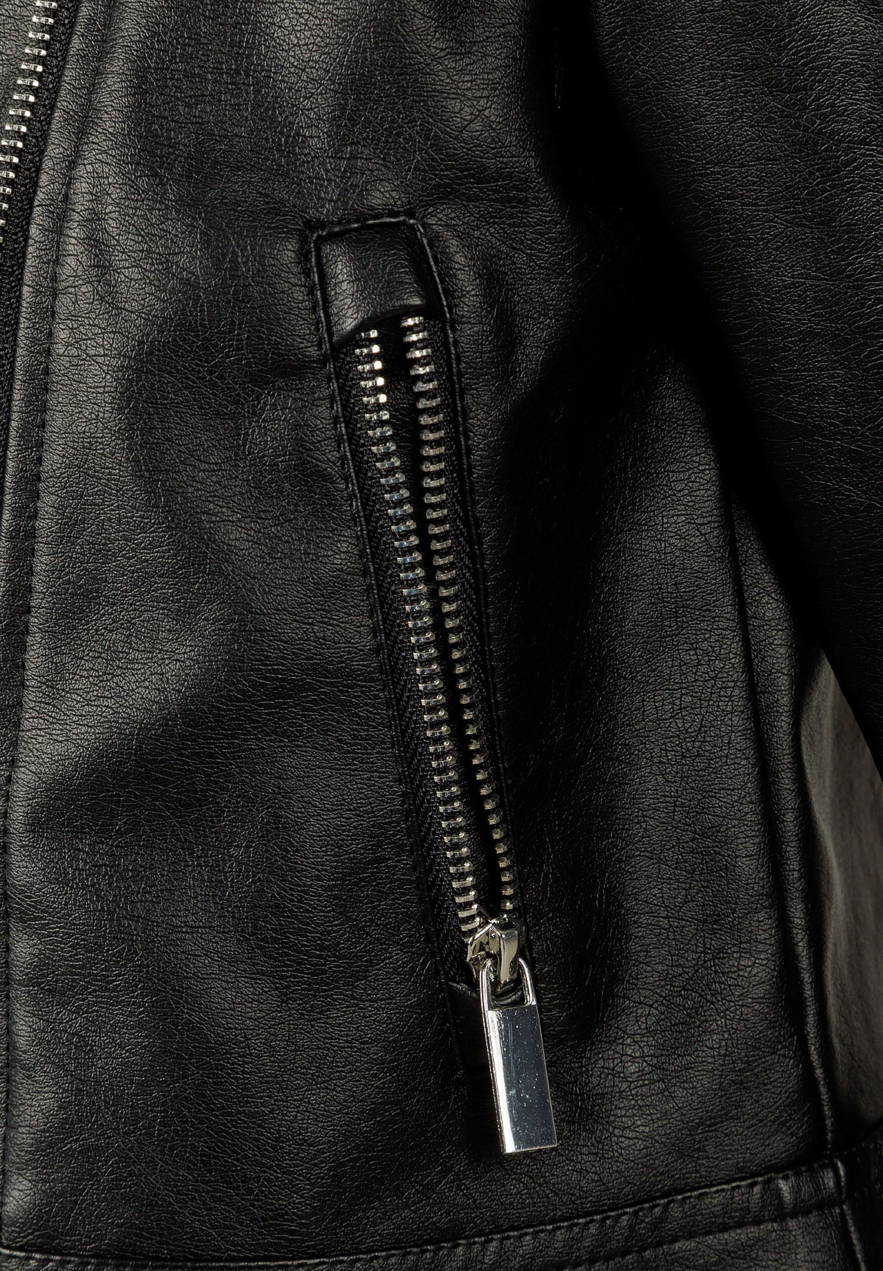 Close-up of a black biker jacket showing a silver zip and pocket.