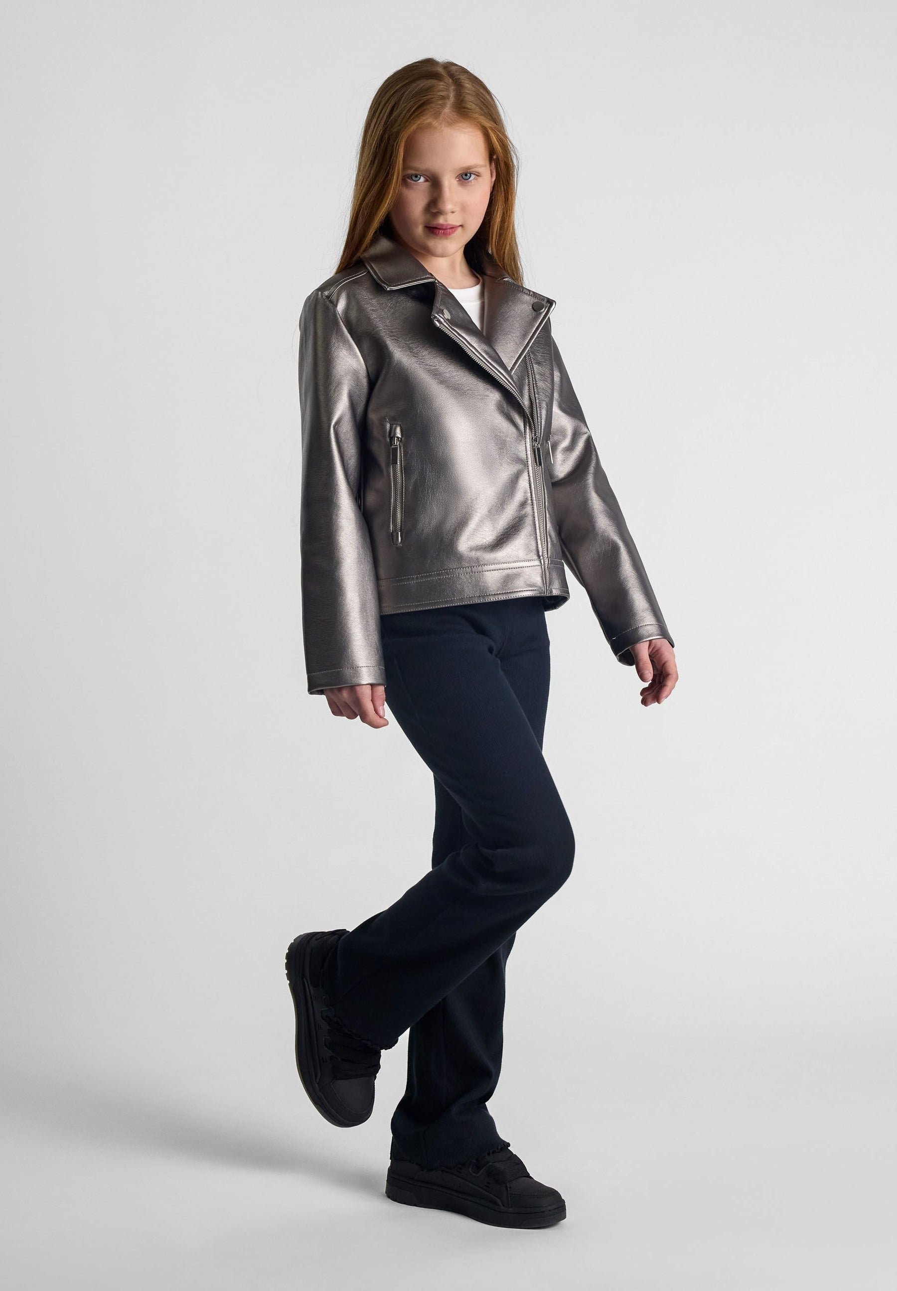 Girls biker style jacket in silver, front view with zipped pockets.