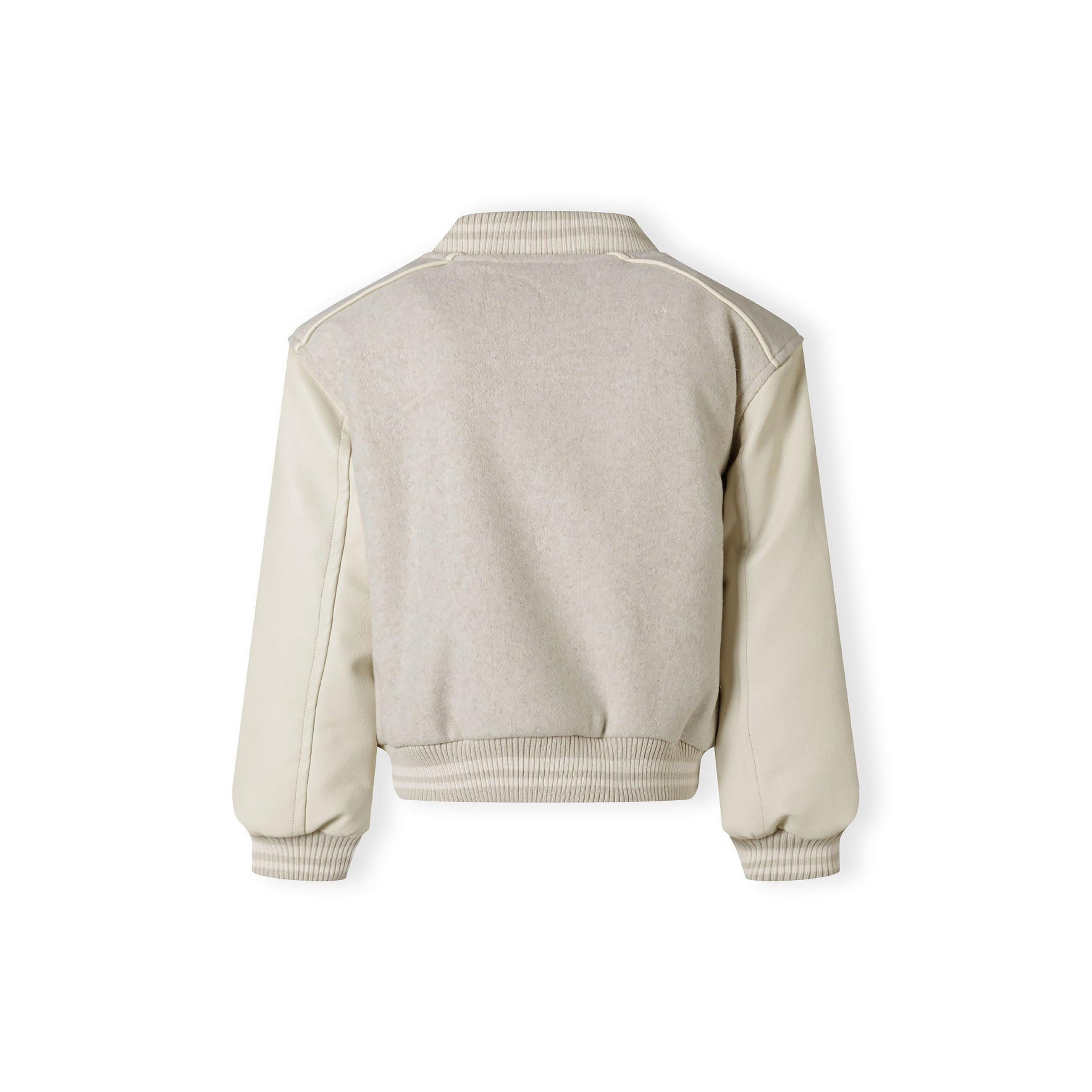 Back view of beige baseball jacket with faux leather sleeves showing ribbed collar and hem details on white background