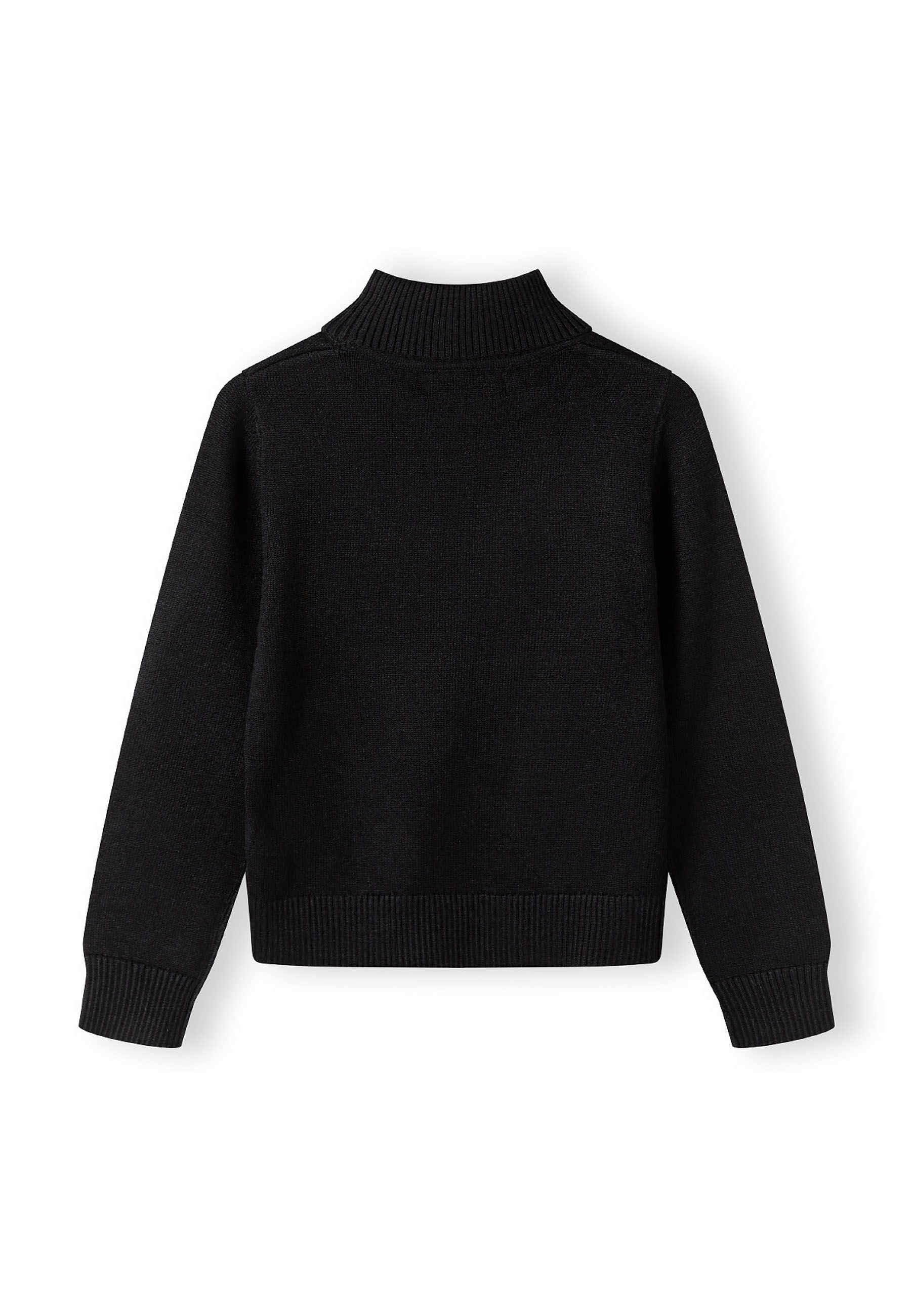 Girls black turtleneck jumper, back view with ribbed cuffs and hem.