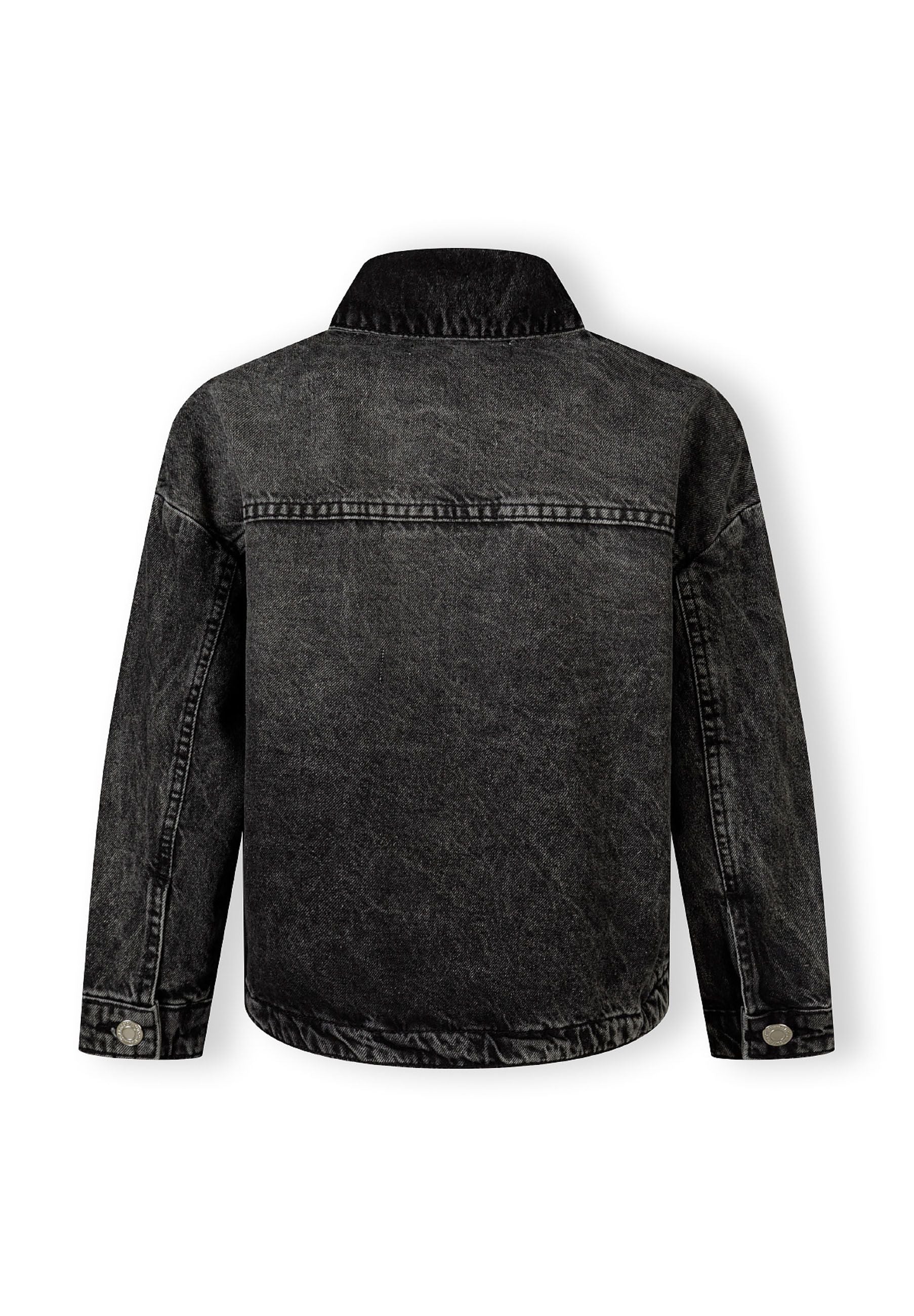 Girls black denim jacket, back view with buttoned cuffs and collar.