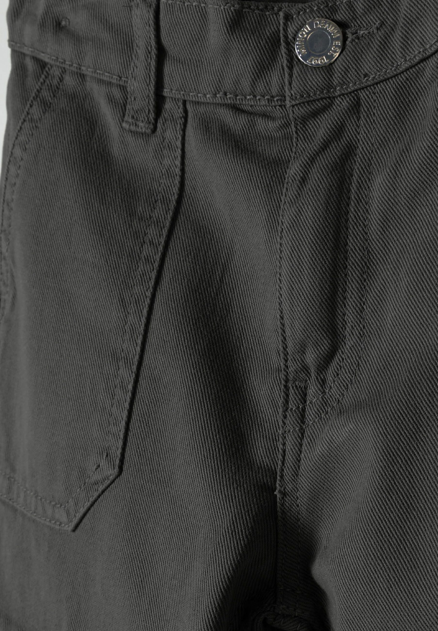 Detail of grey wide leg combat pants with pockets and button.