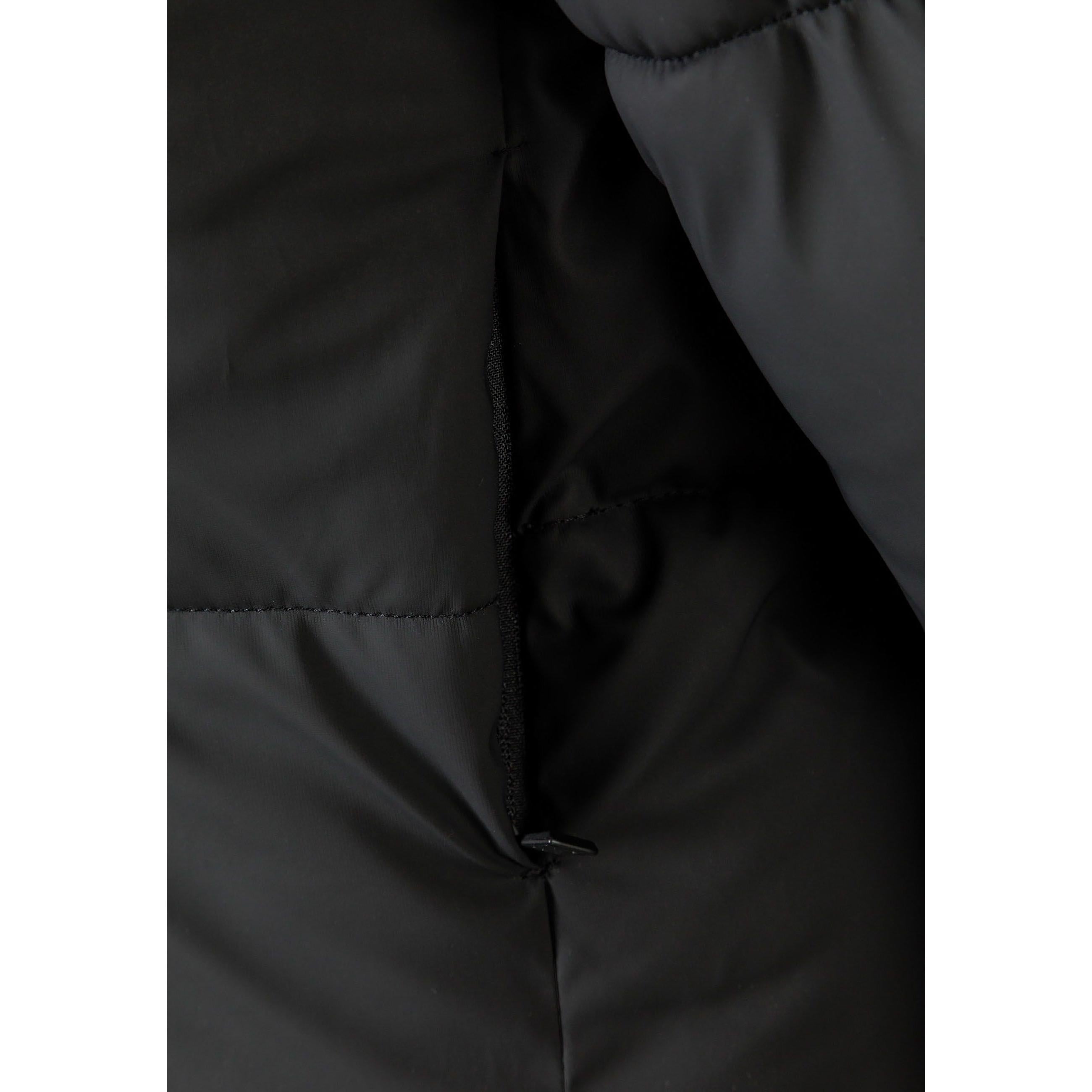 Close-up detail of black water-repellent fabric texture and quilted stitching pattern