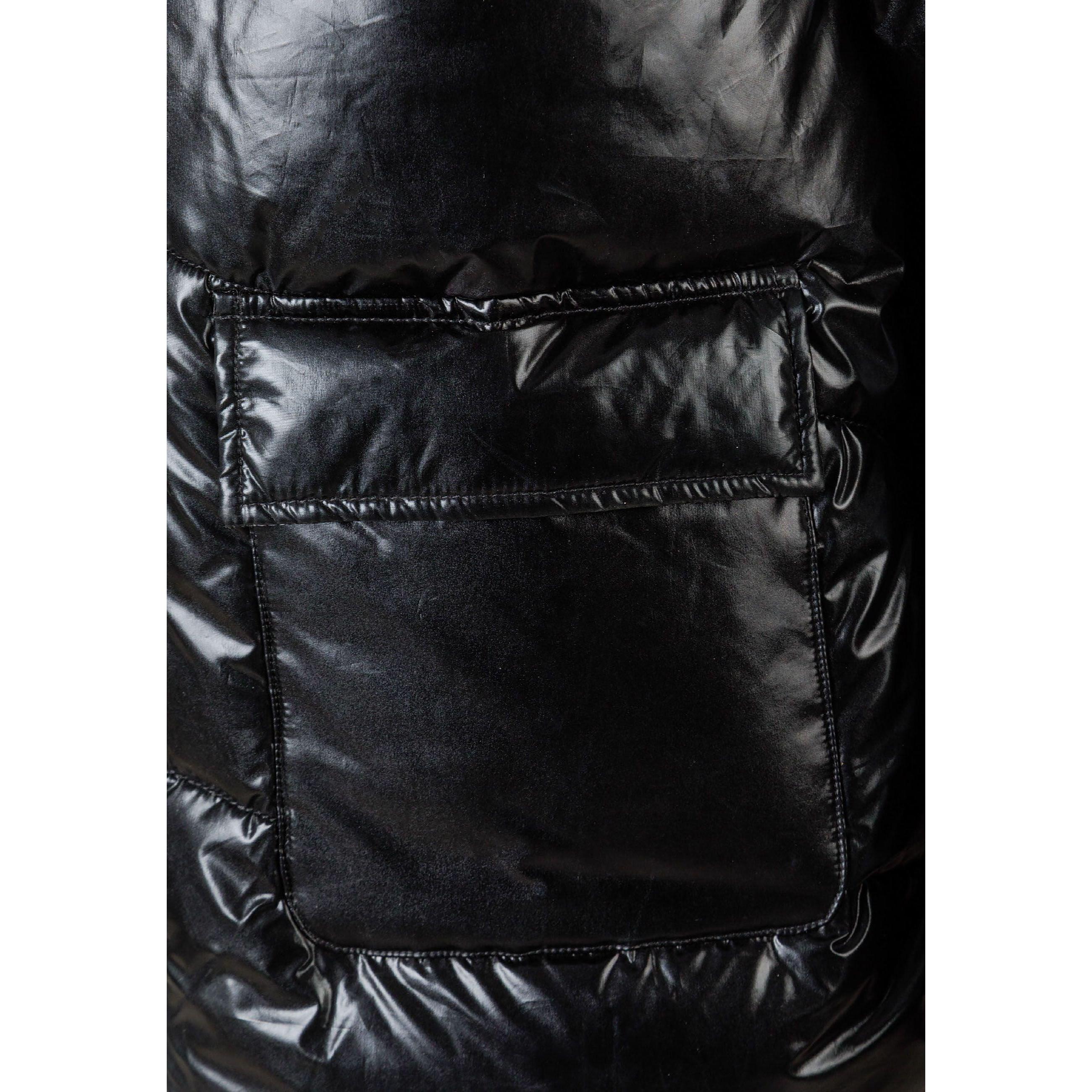 Close-up detail of black jacket showing zip pocket with quilted stitching pattern
