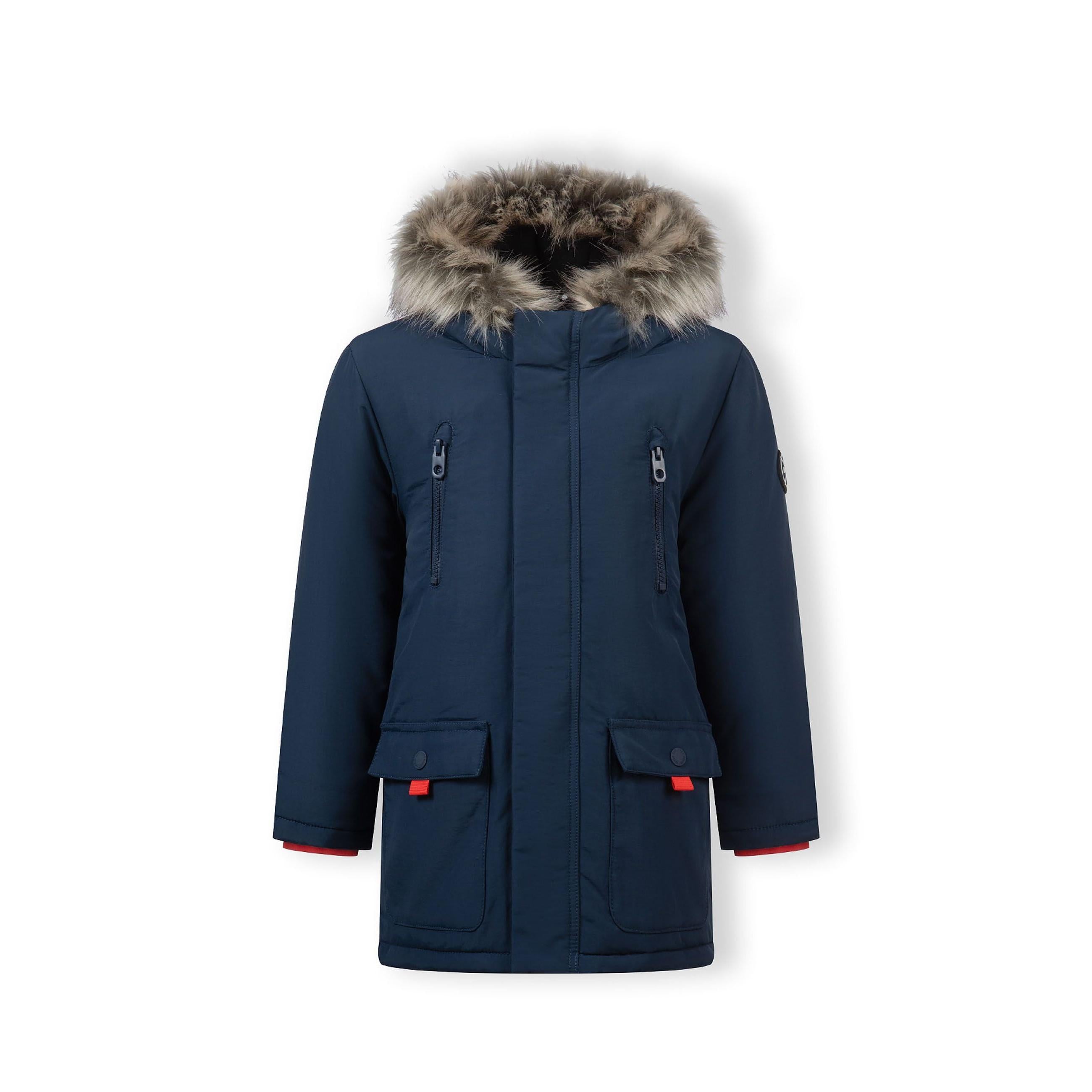 Navy winter parka displayed flat showing faux fur hood trim, multiple pockets and Minoti brand label detail on white background