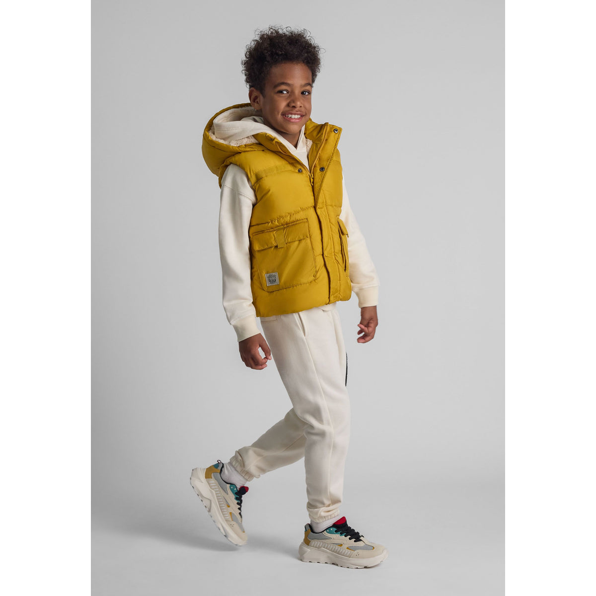 Boys' padded gilet in mustard yellow — complete product view for square Shop card