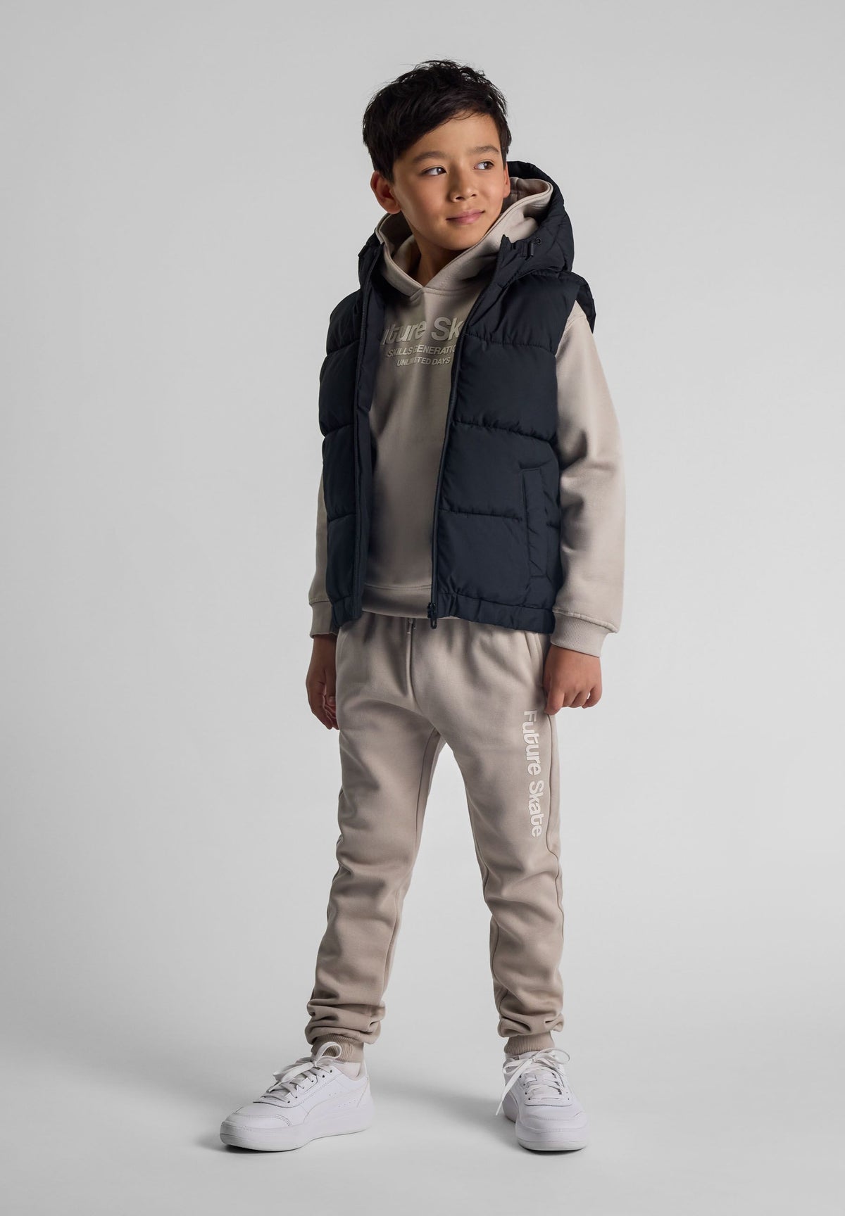 Black padded gilet, model front.