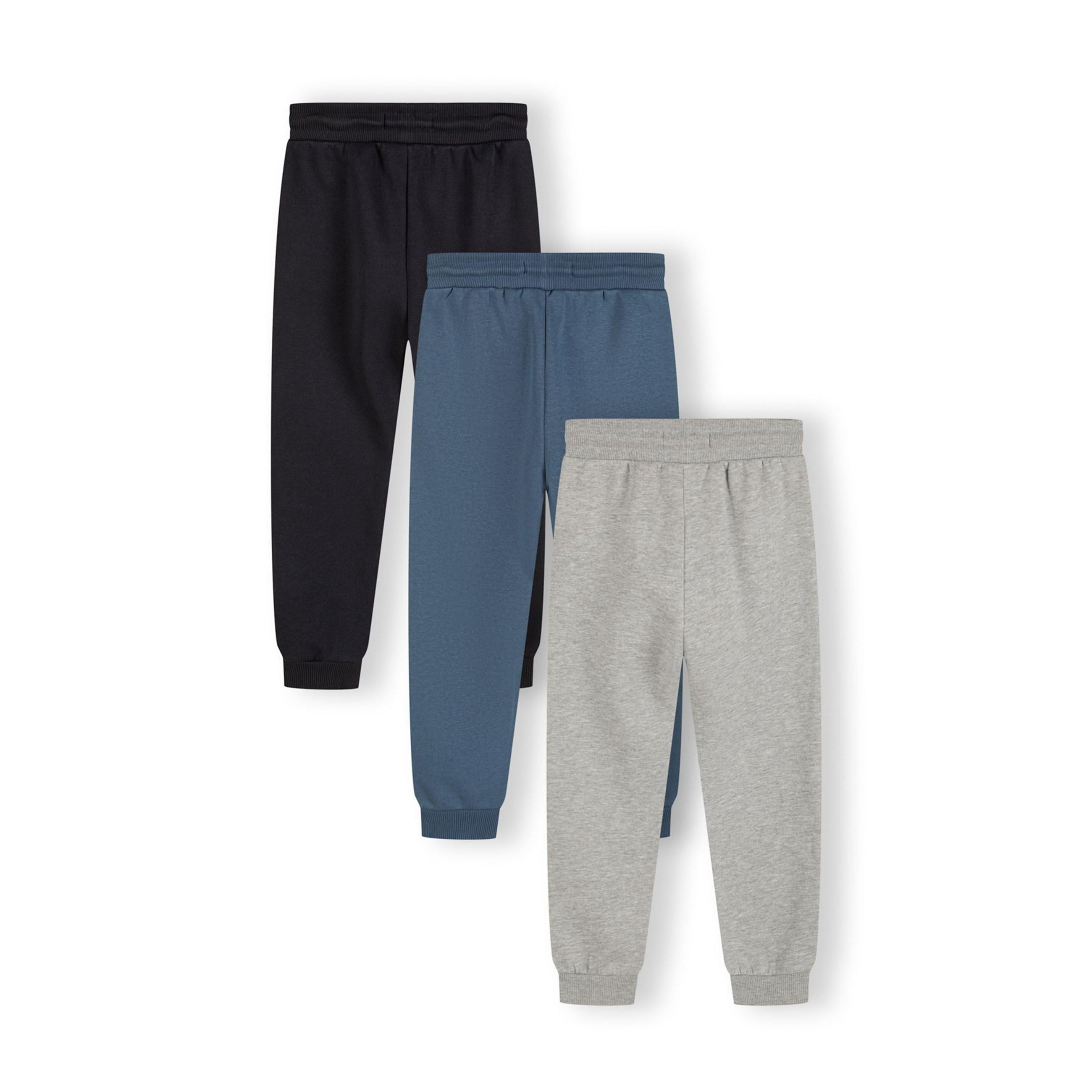 Single grey children's sweatpants laid flat showing front view with drawstring waist, side pockets and ribbed ankle cuffs against white background