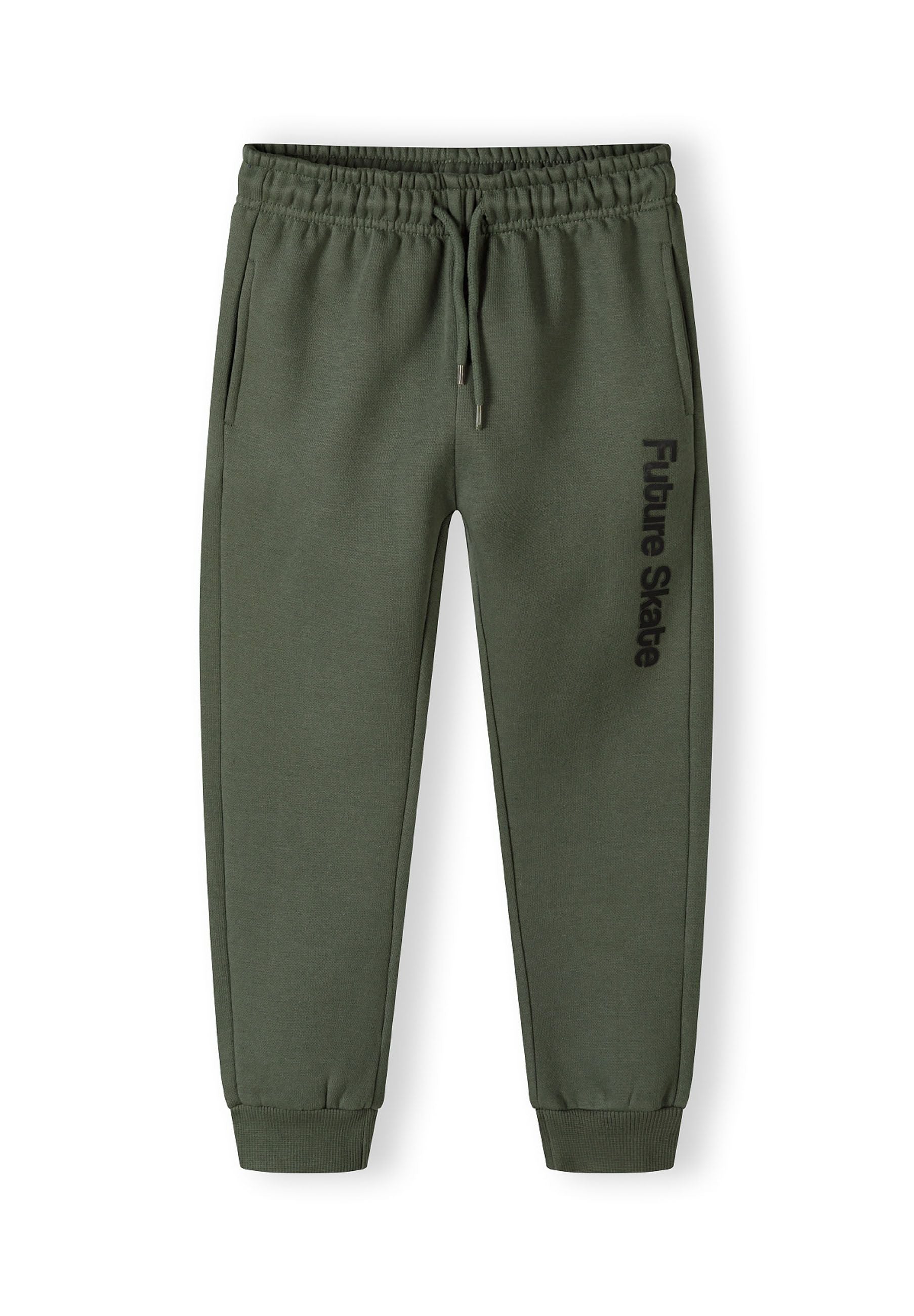 Detail of khaki jogger pants with 'Future Skate' print and ribbed ankle cuffs.