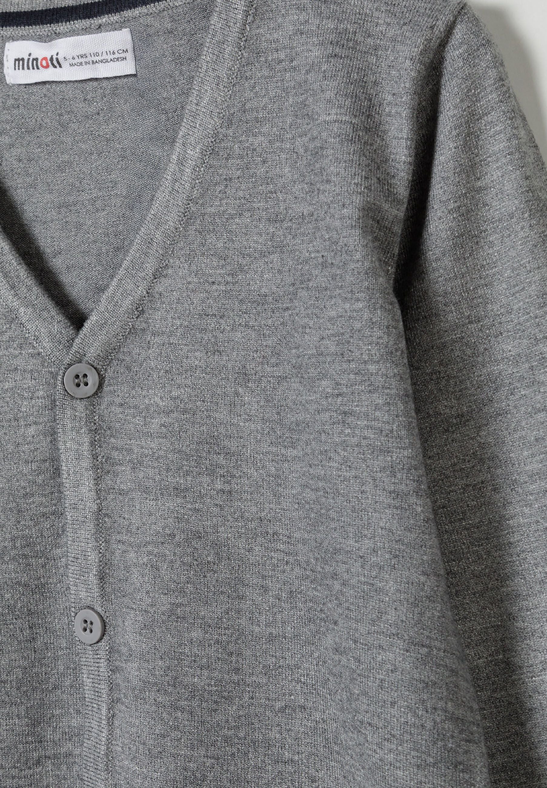 Detail of a boys grey fine knit cardigan with button-down front and v-neckline.