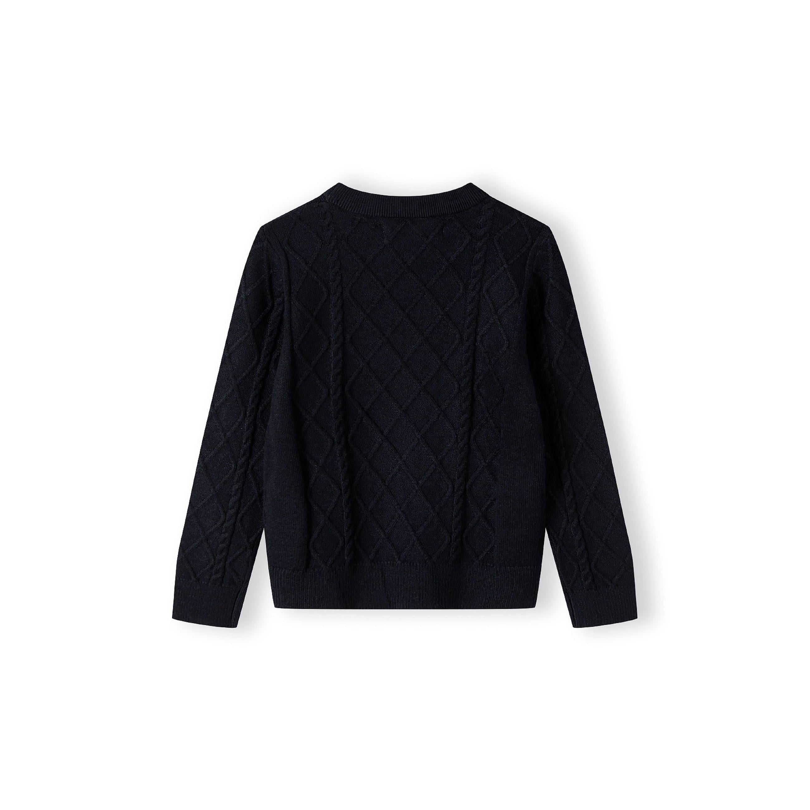 Navy cable knit jumper laid flat showing full garment with raised diamond pattern texture and crew neckline on white background