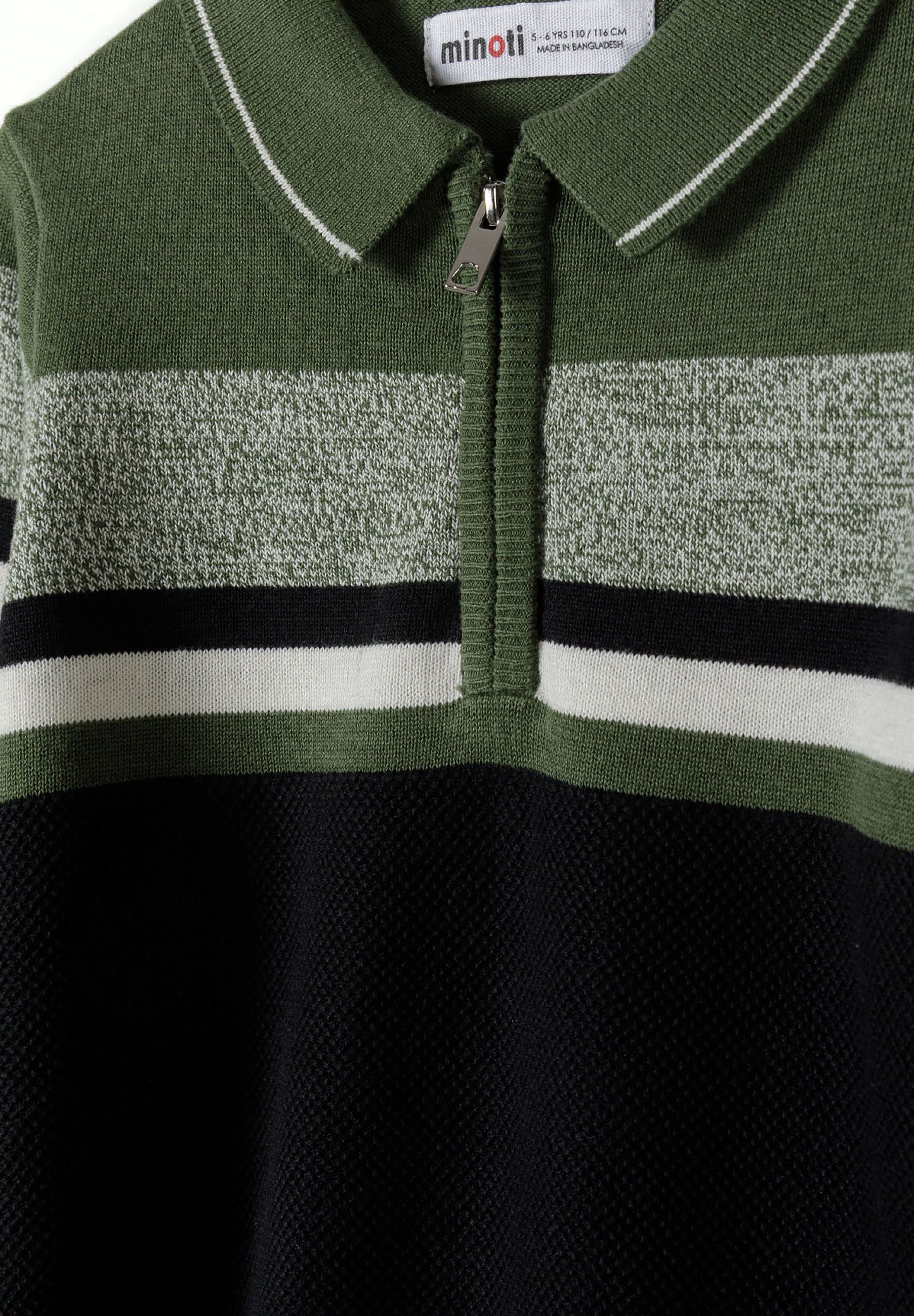 Detail of a boys' khaki sweater with quarter zip and horizontal stripes.