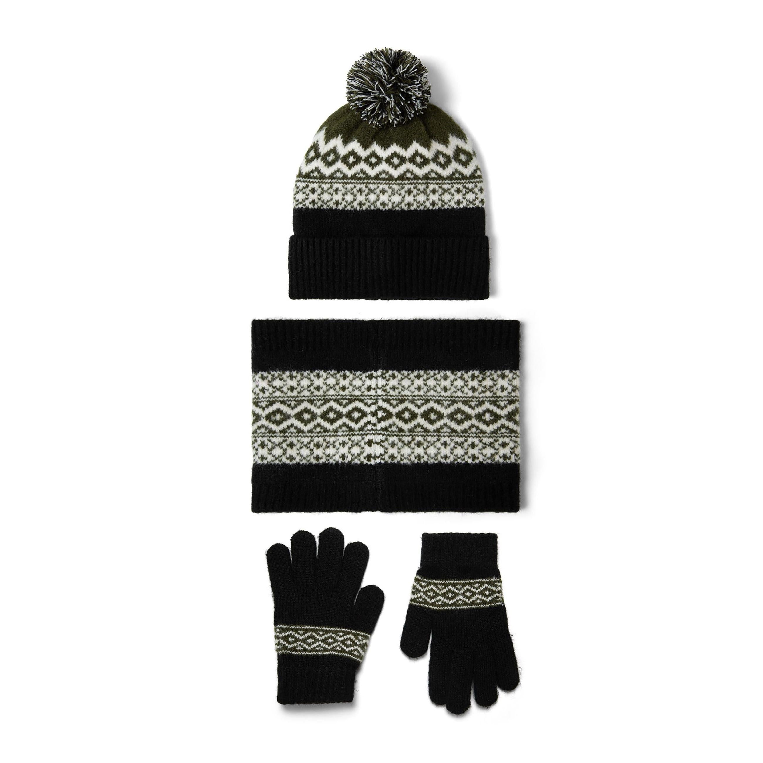 Complete three-piece winter accessory set laid flat showing black knit hat with pom pom, matching snood and gloves with fair isle pattern